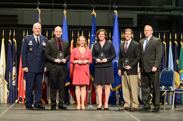 Maj. Gen. Tom Masiello and Dr. Morley Stone (far right) presented four Air Force Research Laboratory Early Career Awards Oct. 30, 2014 at the National Museum of the U.S. Air Force. The award recognizes AFRL's most outstanding young scientists and engineers for scientific or engineering work early in their careers. From left: Dr. Frederick Leve, Research Aerospace Engineer, Space Vehicles Directorate; Dr. Tiffany Jastrzembski, cognitive research scientist, 711th Human Performance Wing; Dr. Janet Wolfson, senior mechanical engineer, Munitions Directorate; and Dr. Derek Kingston, Unmanned Aerial Vehicle team lead, Control Science Center of Excellence, Aerospace Systems Directorate.
Maj. Gen. Masiello is AFRL commander, and Dr. Stone, AFRL chief technology officer. (U.S. Air Force photo/Wesley Farnsworth)