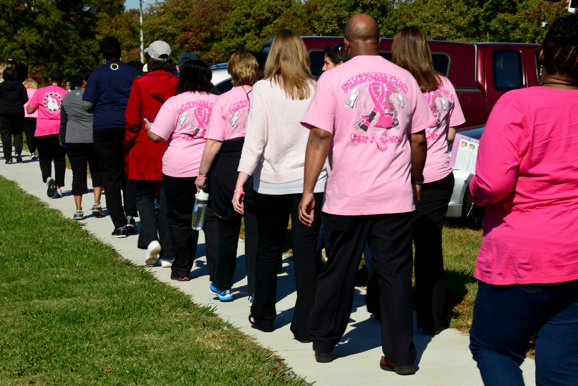 Members of the Fort Eustis community participate in the Breast Cancer Awareness Month walk at Fort Eustis, Va., Oct. 30, 2014. McDonald Army Health Center hosted the walk as an opportunity to raise awareness and remind women to schedule routine check-ups and mammograms. (U.S. Air Force photo by Airman 1st Class Kimberly Nagle/Released)