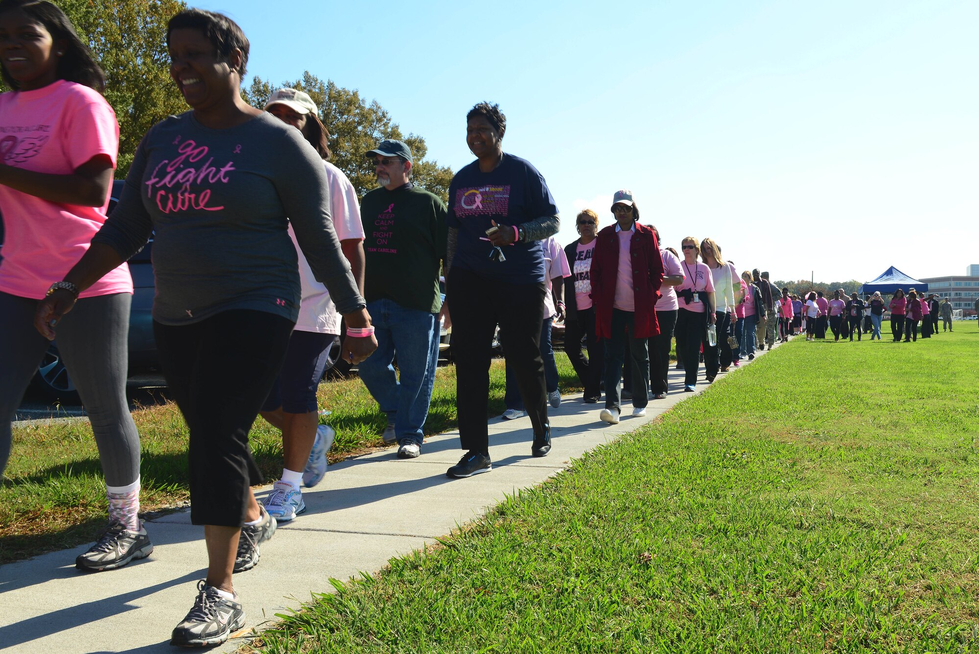 Members of the Fort Eustis community walk in support of Breast Cancer Awareness Month at Fort Eustis, Va., Oct. 30, 2014. According to the National Breast Cancer Foundation, one in eight women will be diagnosed with breast cancer in their lifetime. (U.S. Air Force photo by Airman 1st Class Kimberly Nagle/Released)