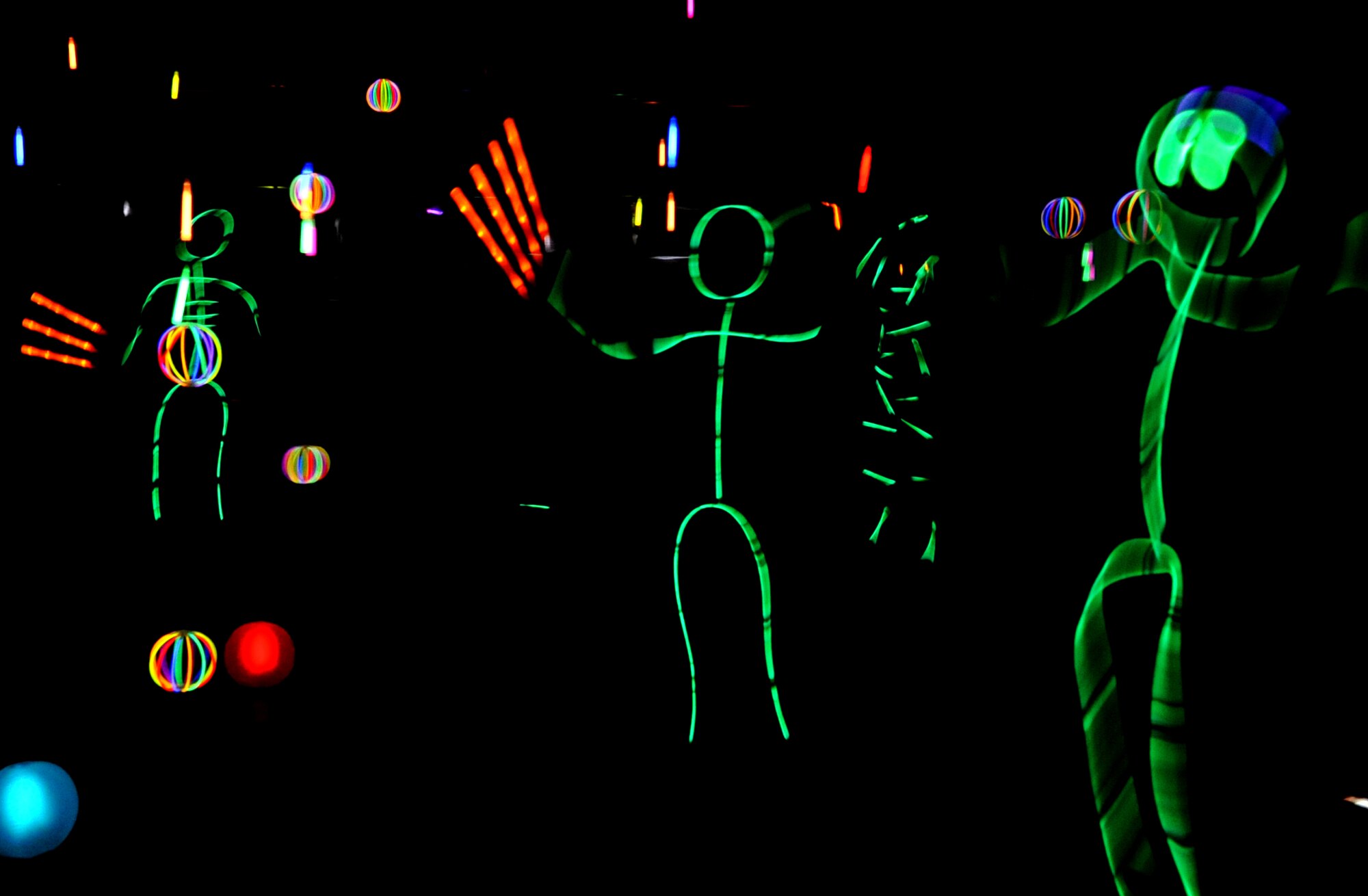 Members of the 319th Medical Group put together a glow stick-themed room for guests of the clinic’s annual trick-or-treat event Oct. 30, 2014, on Grand Forks Air Force Base, N.D. Each office in the clinic created its own theme where children could collect candy, dance to music, and even watch scenes from popular movies. (U.S. Air Force photo/Staff Sgt. Susan L. Davis)