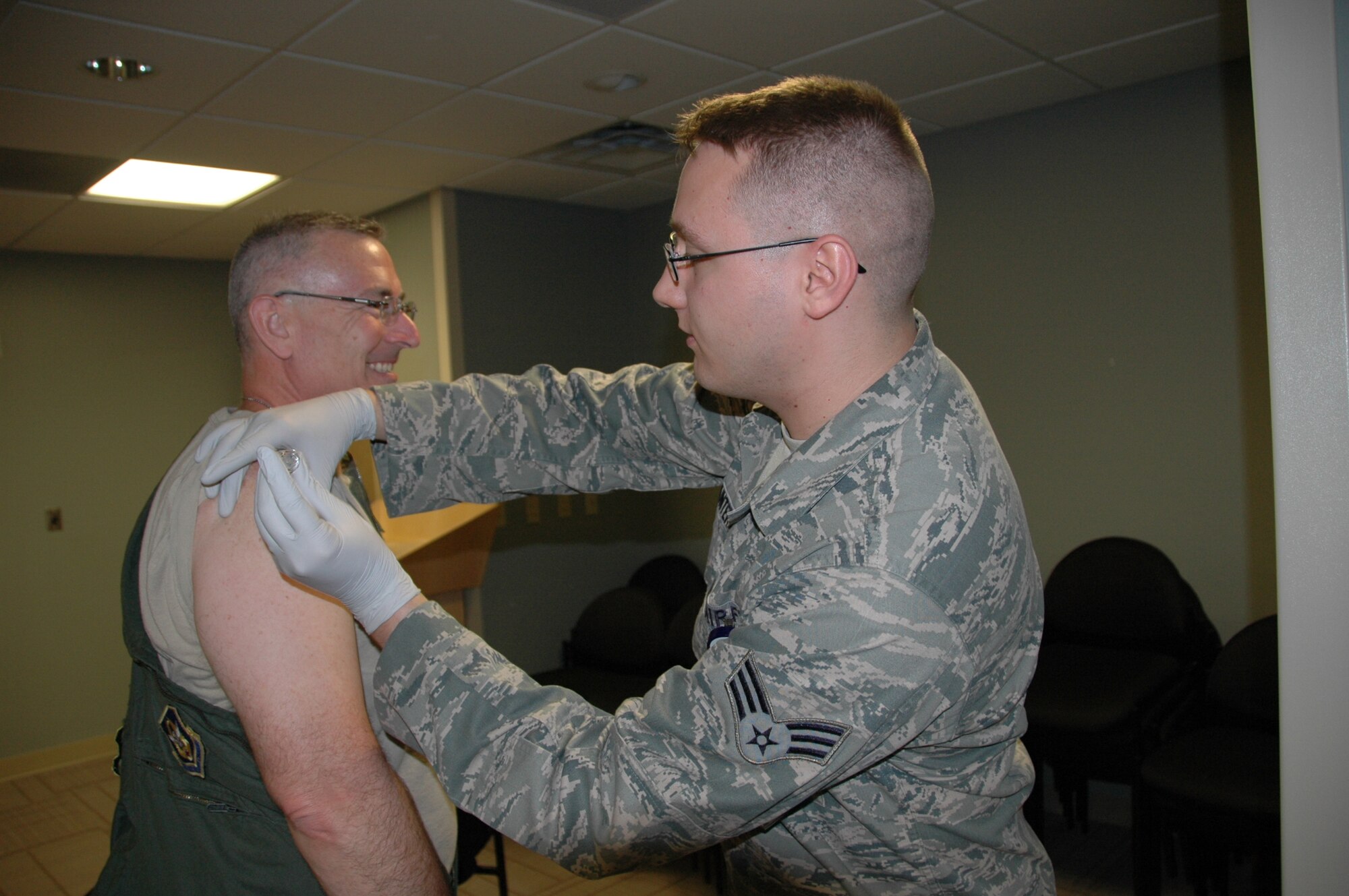 Col. Jonathan M. Philebaum, 512th Operations Group commander, receives his flu vaccine Oct. 1, 2014, during a flu shot clinic held on Dover Air Force Base, Del. The 512th Airlift Wing is currently at 55 percent completion for flu-shot vaccines, with more than 800 administered so far. Reservists can receive their flu shot from 7:45 a.m. - 3 p.m. Saturday and from 12:30 - 3 p.m. Sunday at the Medical Treatment Facility. (U.S. Air Force photo/Master Sgt. Veronica Aceveda)