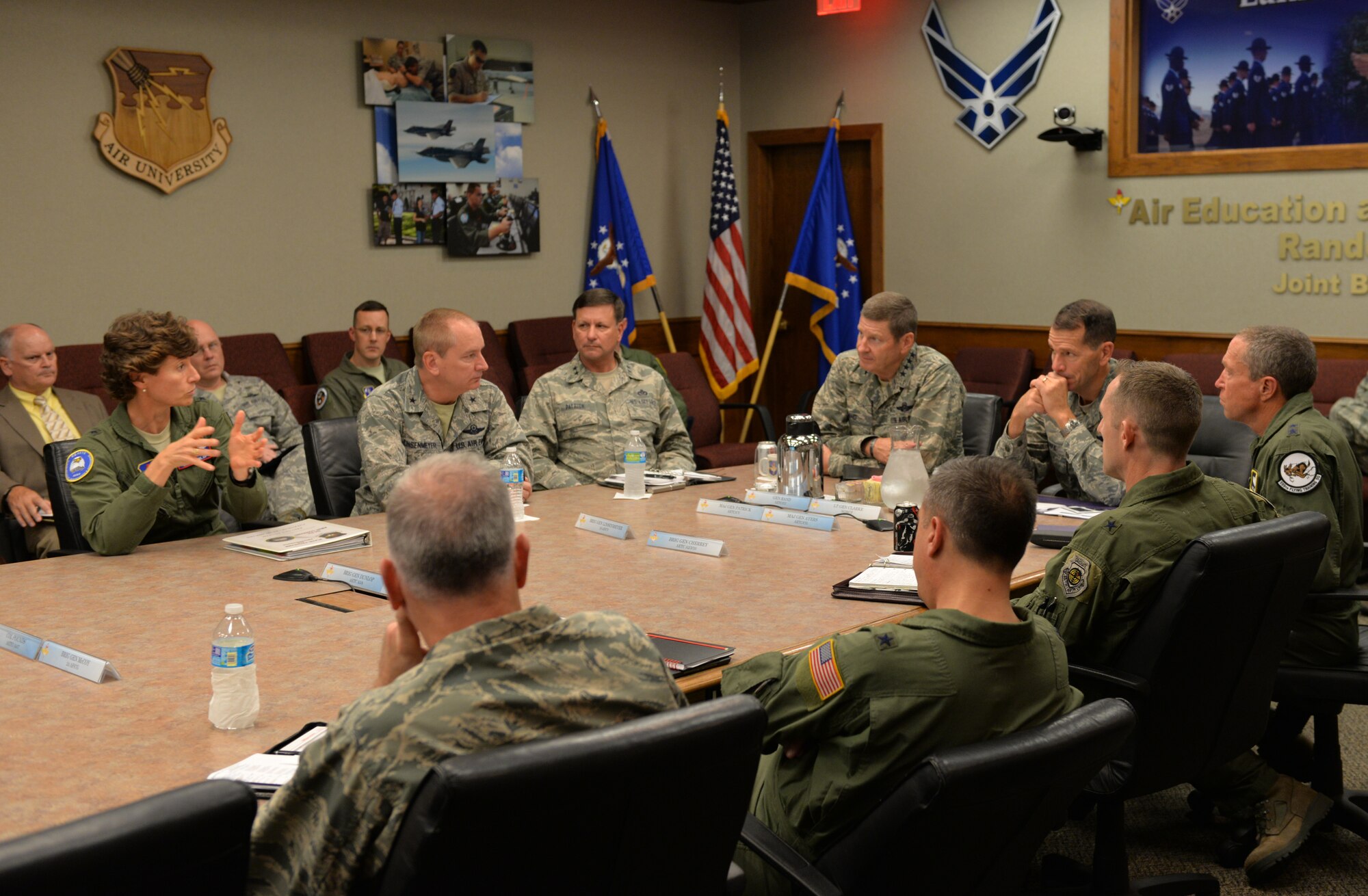 Gen. Robin  Rand (center left), commander of Air Education and Training Command, and Lt. Gen. Stanley E. Clarke III (center right), director of the Air National Guard, listen to Brig. Gen. Dawn Dunlop (far left), AETC director of Plans, Programs and Requirements, during discussions at the AETC/ANG Focus Day Oct. 30 at Joint Base San Antonio-Randolph. The event brought Airmen from the command's active duty and Guard components together to continue strengthening their key Air Force partnership. "It's a fantastic relationship and we're using this time to make it even better, finding ways to improve and get the right mix of people doing the Air Force's education and training," said Rand. (U.S. photo by Tech. Sgt. Beth Anschutz)
