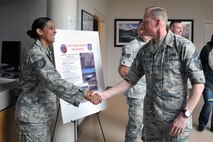 Chief Master Sgt. of the Air Force James Cody greets Tech. Sgt. Jessica Zerr, 567th Red Horse Squadron, while visiting Seymour Johnson Air Force Base, North Carolina, Oct. 10. During the visit, Cody spent time with Airmen of the 916th Air Refueling Wing and its Total Force Associate partner, the 911th Air Refueling Squadron. (U.S. Air Force photo/Staff Sgt. Alan Abernethy)