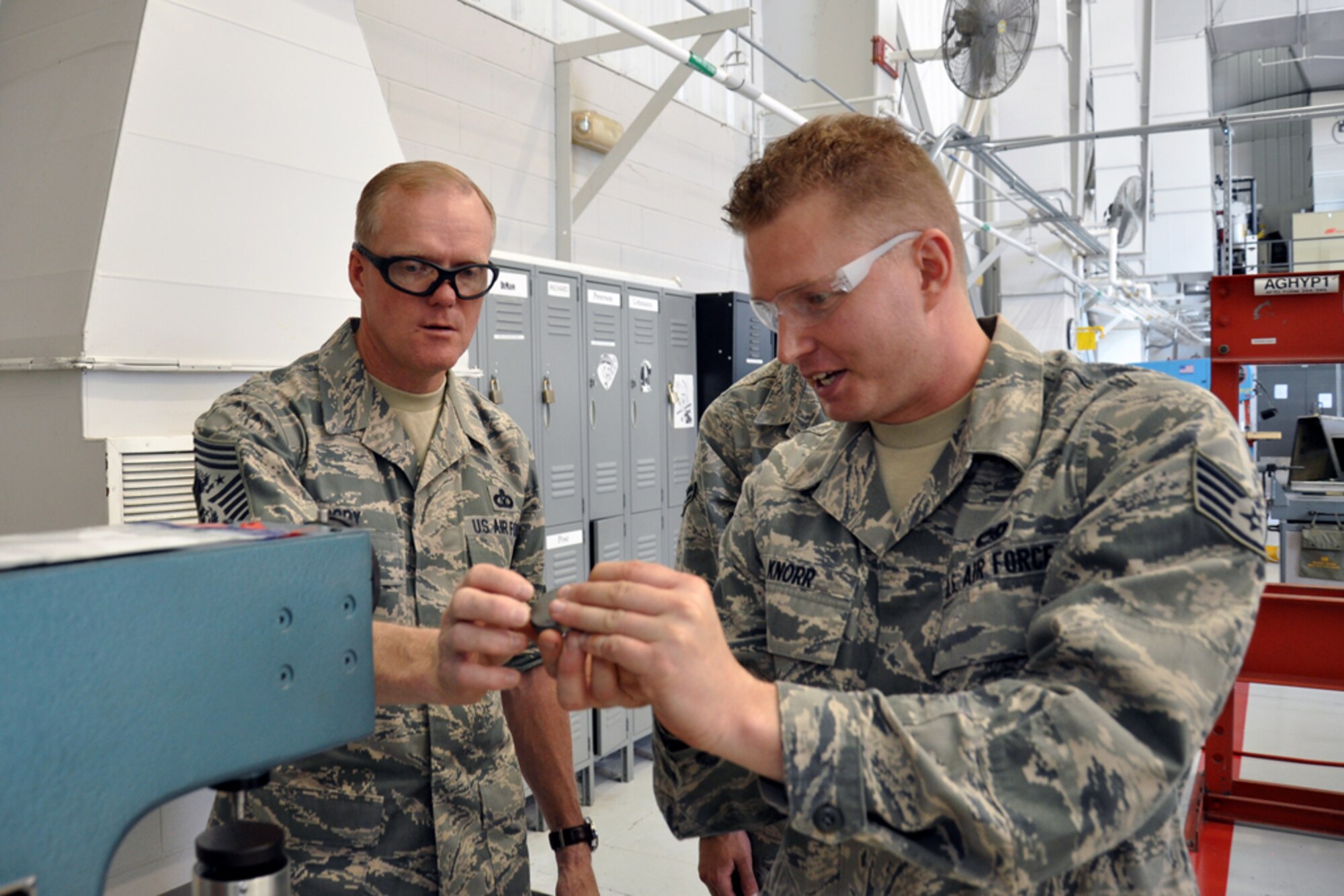 Chief Master Sgt. of the Air Force James Cody discusses maintenance operations functions with Staff Sgt. Isaiah Knorr, 916th Air Refueling Wing, while he visited Seymour Johnson Air Force Base, North Carolina, Oct. 10. During the visit, Cody spent time with Airmen of the 916th ARW and its Total Force Associate partner, the 911th Air Refueling Squadron. (U.S. Air Force photo/Staff Sgt. Alan Abernethy)