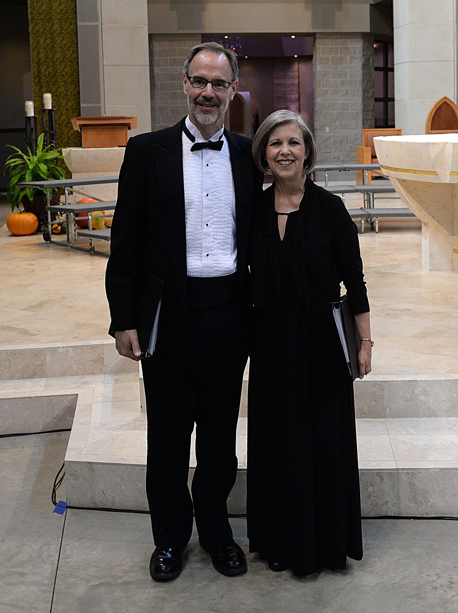 The Blice-Baums prepare for a performance in a local choral group called Masterworks Chorale. The Blice-Baums have been involved together in music throughout their 32 years of marriage. (U.S. Air Force photo/Senior Airman Joshua Eikren)