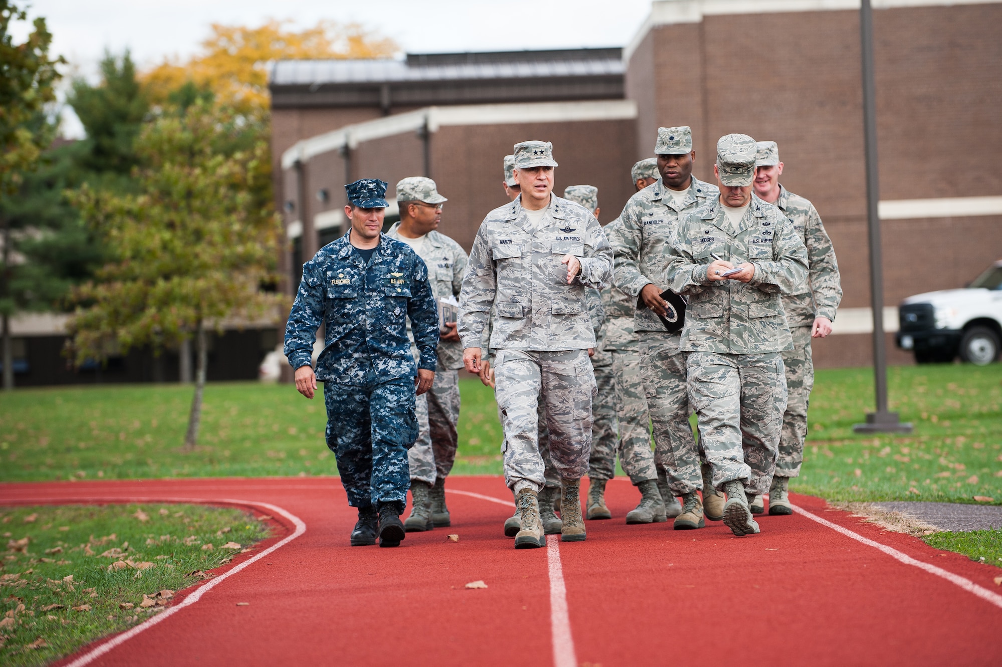 (Center) Maj. Gen. Frederick H. "Rick" Martin, U.S. Air Force Expeditionary Center commander, speaks with members of Joint Base McGuire-Dix-Lakehurst, N.J., leadership following a tour of the McGuire Fitness Center Oct. 14, 2014, on JB MDL. Martin visited various facilities on the installation and was briefed on the operations, missions and improvements base wide. (U.S. Air Force photo by Russ Meseroll/Released)