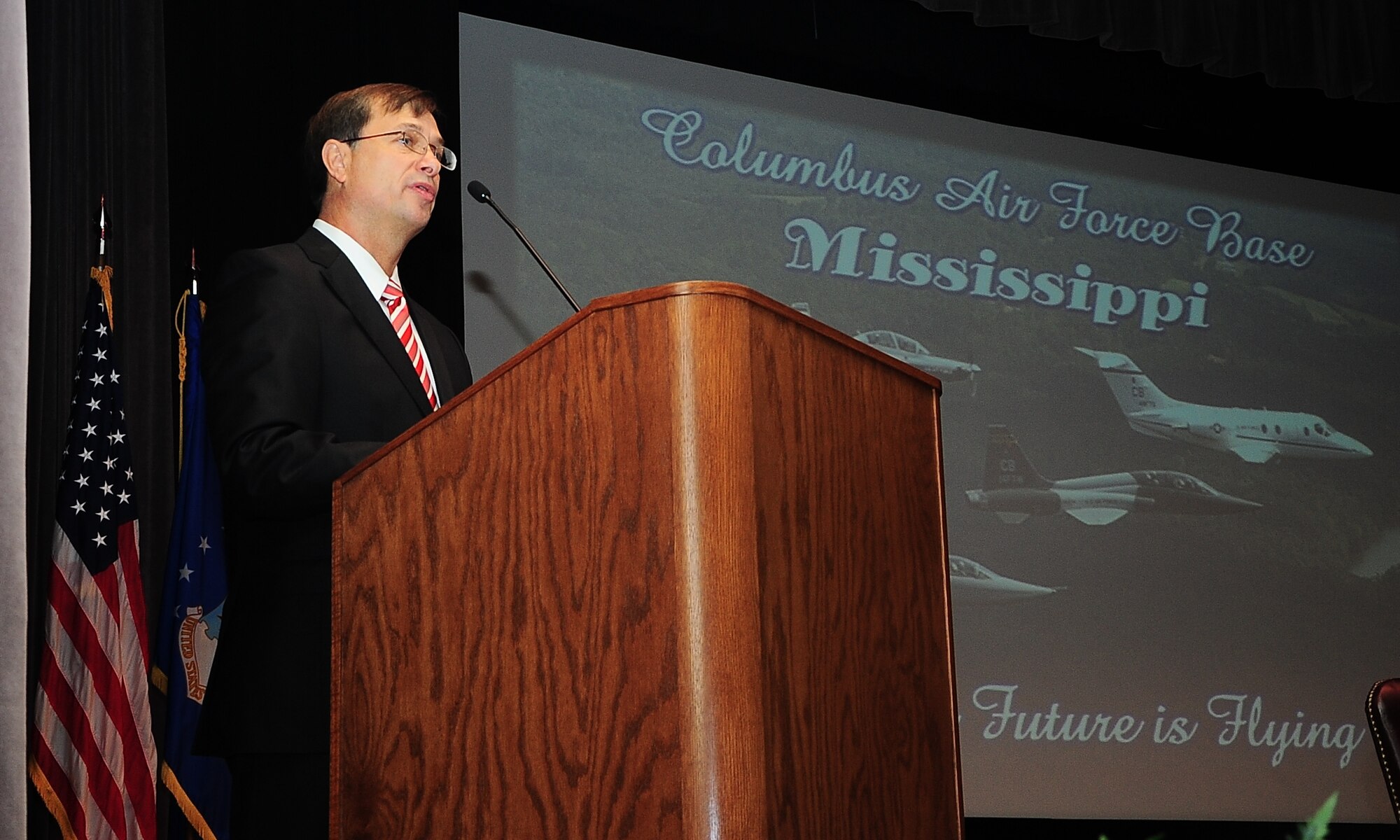 Retired Maj. Gen. Stephen Schmidt, former 14th Flying Training Wing Commander, speaks during Specialized Undergraduate Pilot Training Class 15-01’s graduation Oct. 24 at Columbus Air Force Base, Mississippi. Schmidt gave the graduates life and leadership lessons that he wished he had been told when he was a new pilot. (U.S. Air Force Photo/Airman John Day)