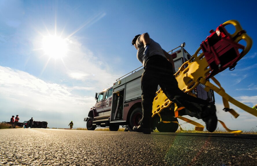 Mildred Rosado'Canales, 39th Medical Group Ambulance Services medical technician, responds to reported casualties during a simulated aircraft mishap Oct. 30, 2014, at Incirlik Air Base, Turkey. Multiple units from the 39th Air Base Wing participated in the exercise to gain proficiency in emergency responses. (U.S. Air Force photo by Airman Cory W. Bush/Released)