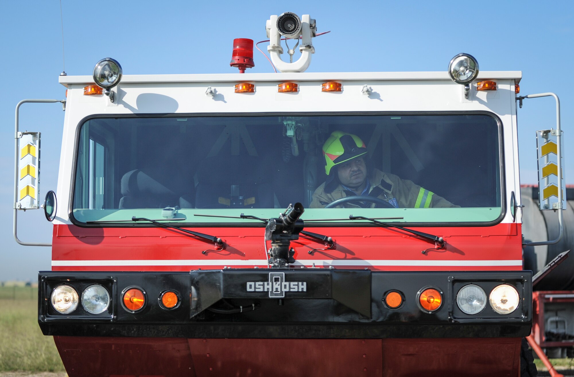 Erhan Dadali, 39th Civil Engineer Squadron Driver Operator, respond to a simulated aircraft mishap Oct. 30, 2014, at Incirlik Air Base, Turkey. The firefighters responded to the crash site, extinguished the remaining flames that were present and proceeded to clear any passengers and crew on board away from danger. (U.S. Air Force photo by Airman Cory W. Bush/Released) 
