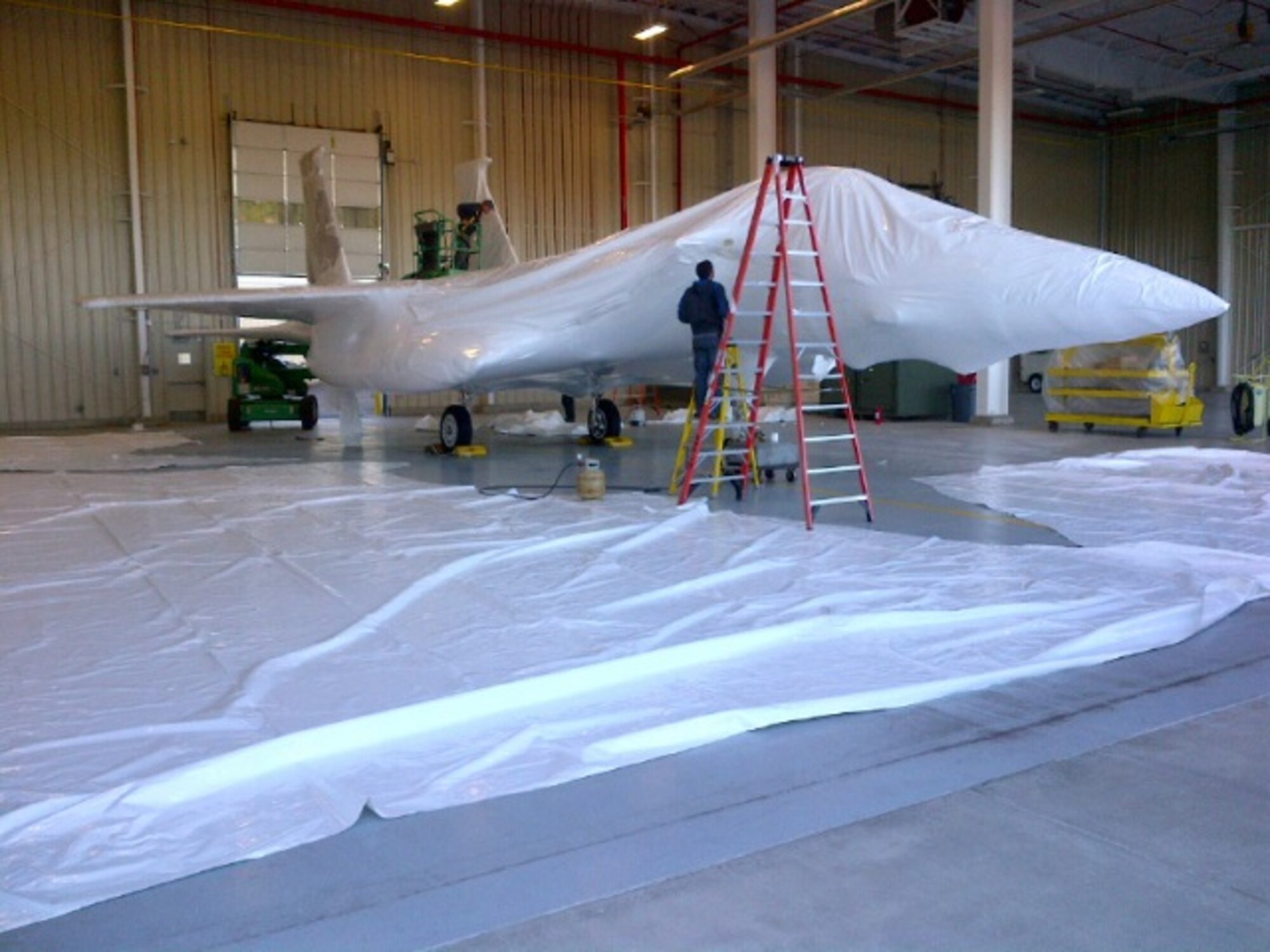 Atlantic Shrink Wrapping Inc. shrink wraps an F-15A Eagle for storage while a permanent location for this static display is selected and built.
(U.S. Air National Guard Photo by Chief Master Sgt. Wayne Brown/Released)