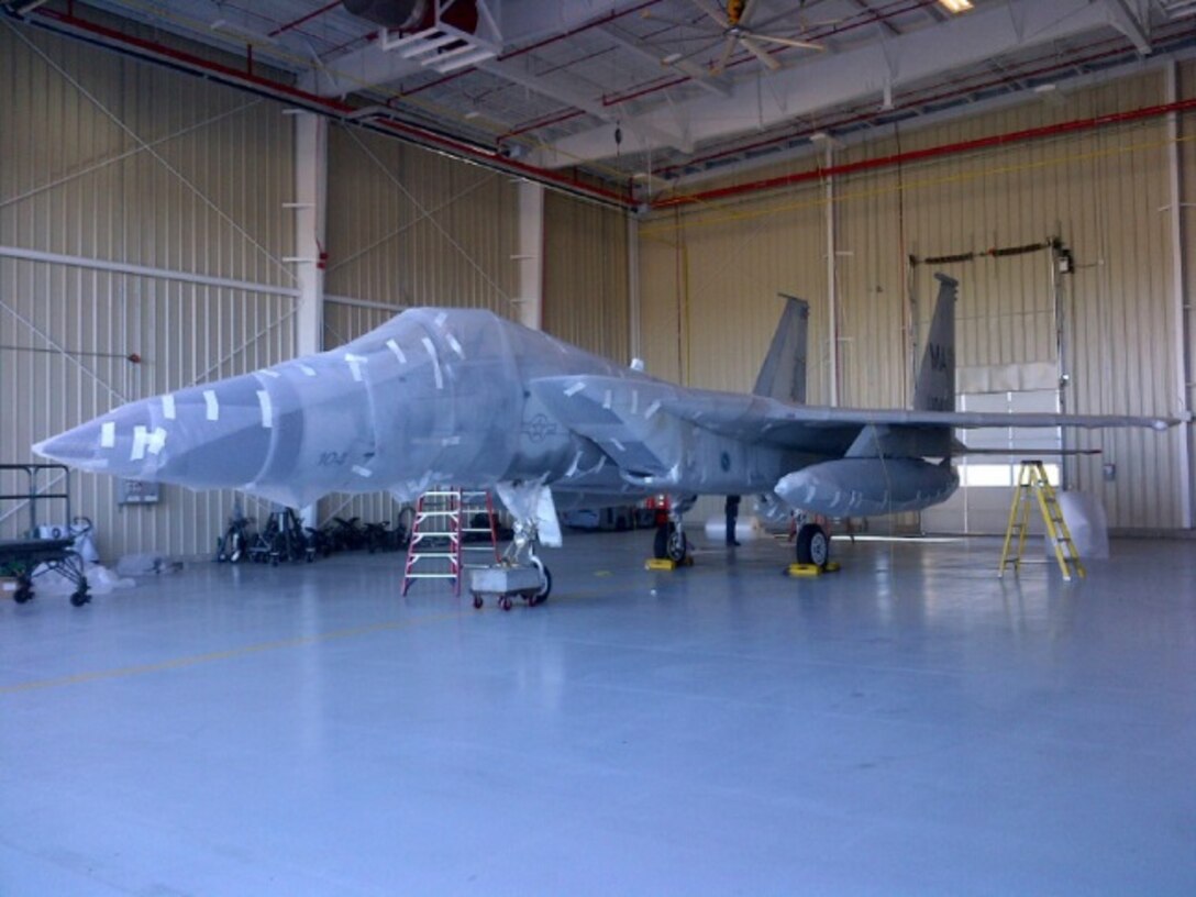 Atlantic Shrink Wrapping Inc. shrink wraps an F-15A Eagle for storage while a permanent location for this static display is selected and built.
(U.S. Air National Guard Photo by Chief Master Sgt. Wayne Brown/Released)