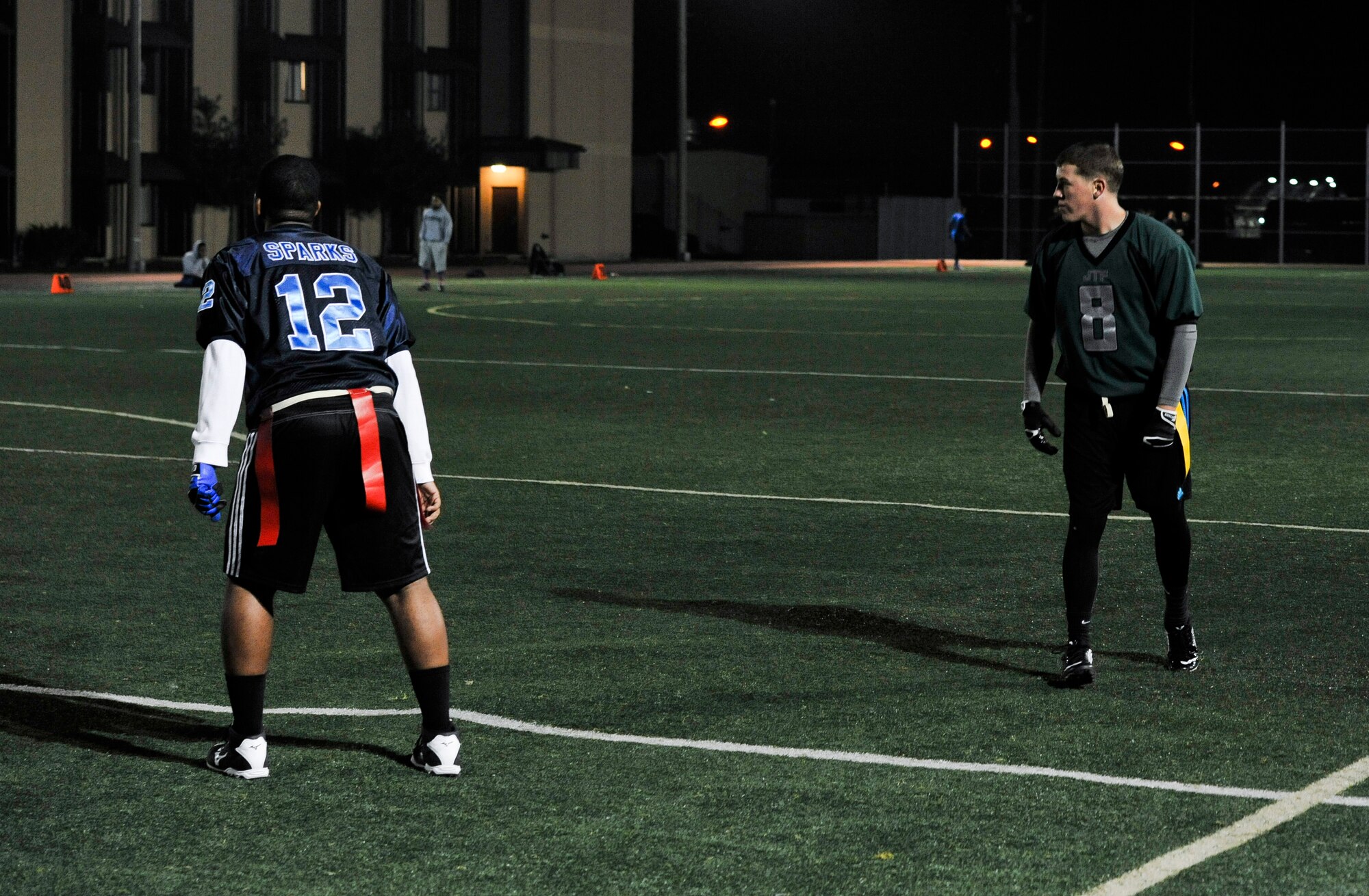 Kyle Harvey, 7th Air Force, waits for the play to start as the team attempts an extra point during an intramural flag football game against the 51st Force Support Squadron team Oct. 29, 2014, on Osan Air Base, Republic of Korea. The team scored the extra point putting them up 25-13. (U.S. Air Force photo by Senior Airman David Owsianka)