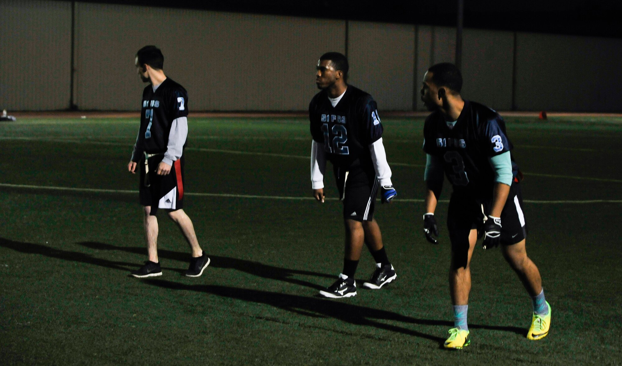 Players on the 51st Force Support Squadron team line up for the play during an intramural flag football game against the 7th Air Force team Oct. 29, 2014, on Osan Air Base, Republic of Korea. FSS held a 13-6 lead going into the second half. (U.S. Air Force photo by Senior Airman David Owsianka)