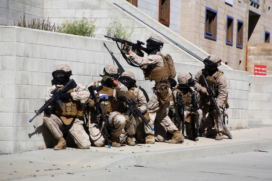 Marines Take Cover Behind A Wall During A Training Evolution Using ...