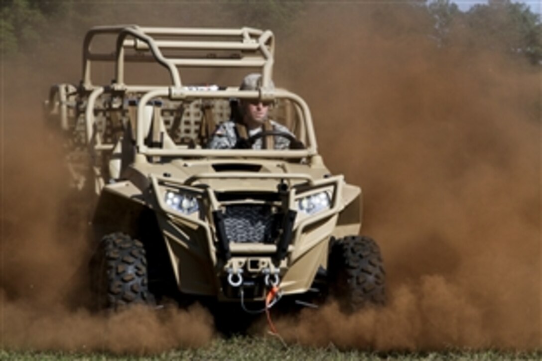 A soldier drives a new light-tactical, all-terrain vehicle on Fort Bragg, N.C., Oct. 29, 2014. The soldier is a paratrooper assigned to the 82nd Airborne Division's 1st Battalion, 325th Airborne Infantry Regiment, 2nd Brigade Combat Team.

