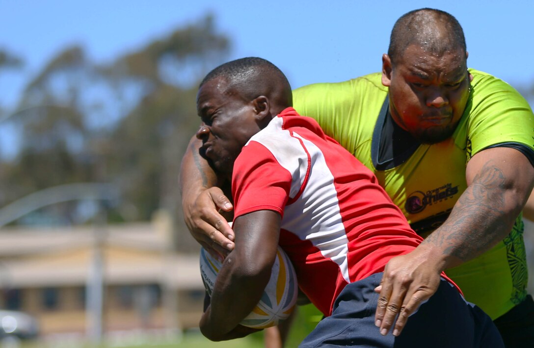 Marines and sailors are competing for a place on the All Navy and Marine Corps rugby team to represent our country in the Common Wealth Navies Rugby Cup located in New Zealand.There are currently 35 members of the All Navy and Marine Corps team, but only about 28 will be going to the rugby motherland. They claimed a 21-7 victory over the Oceanside Chiefs, a division two rugby team with three division titles and one national title, in their first local scrimmage at Paige Field House here, Aug. 30.(Photo by Cpl. Keenan Zelazoski)