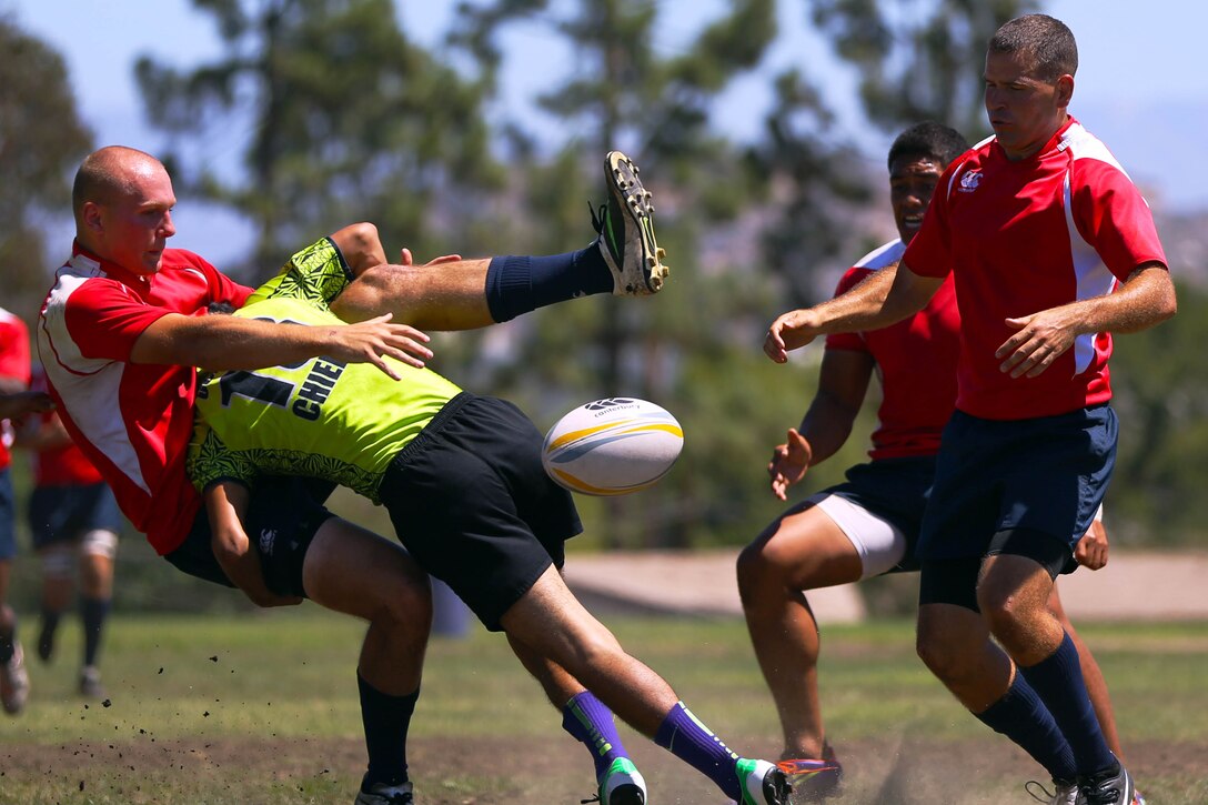Marines and sailors are competing for a place on the All Navy and Marine Corps rugby team to represent our country in the Common Wealth Navies Rugby Cup located in New Zealand.There are currently 35 members of the All Navy and Marine Corps team, but only about 28 will be going to the rugby motherland. They claimed a 21-7 victory over the Oceanside Chiefs, a division two rugby team with three division titles and one national title, in their first local scrimmage at Paige Field House here, Aug. 30.(Photo by Cpl. Keenan Zelazoski)