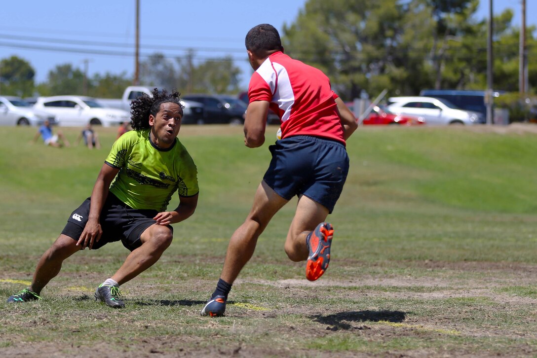 Marines and sailors are competing for a place on the All Navy and Marine Corps rugby team to represent our country in the Common Wealth Navies Rugby Cup located in New Zealand.There are currently 35 members of the All Navy and Marine Corps team, but only about 28 will be going to the rugby motherland. They claimed a 21-7 victory over the Oceanside Chiefs, a division two rugby team with three division titles and one national title, in their first local scrimmage at Paige Field House here, Aug. 30.(Photo by Cpl. Keenan Zelazoski)