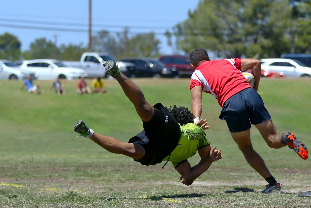 Marines and sailors are competing for a place on the All Navy and Marine Corps rugby team to represent our country in the Common Wealth Navies Rugby Cup located in New Zealand.There are currently 35 members of the All Navy and Marine Corps team, but only about 28 will be going to the rugby motherland. They claimed a 21-7 victory over the Oceanside Chiefs, a division two rugby team with three division titles and one national title, in their first local scrimmage at Paige Field House here, Aug. 30.(Photo by Cpl. Keenan Zelazoski)