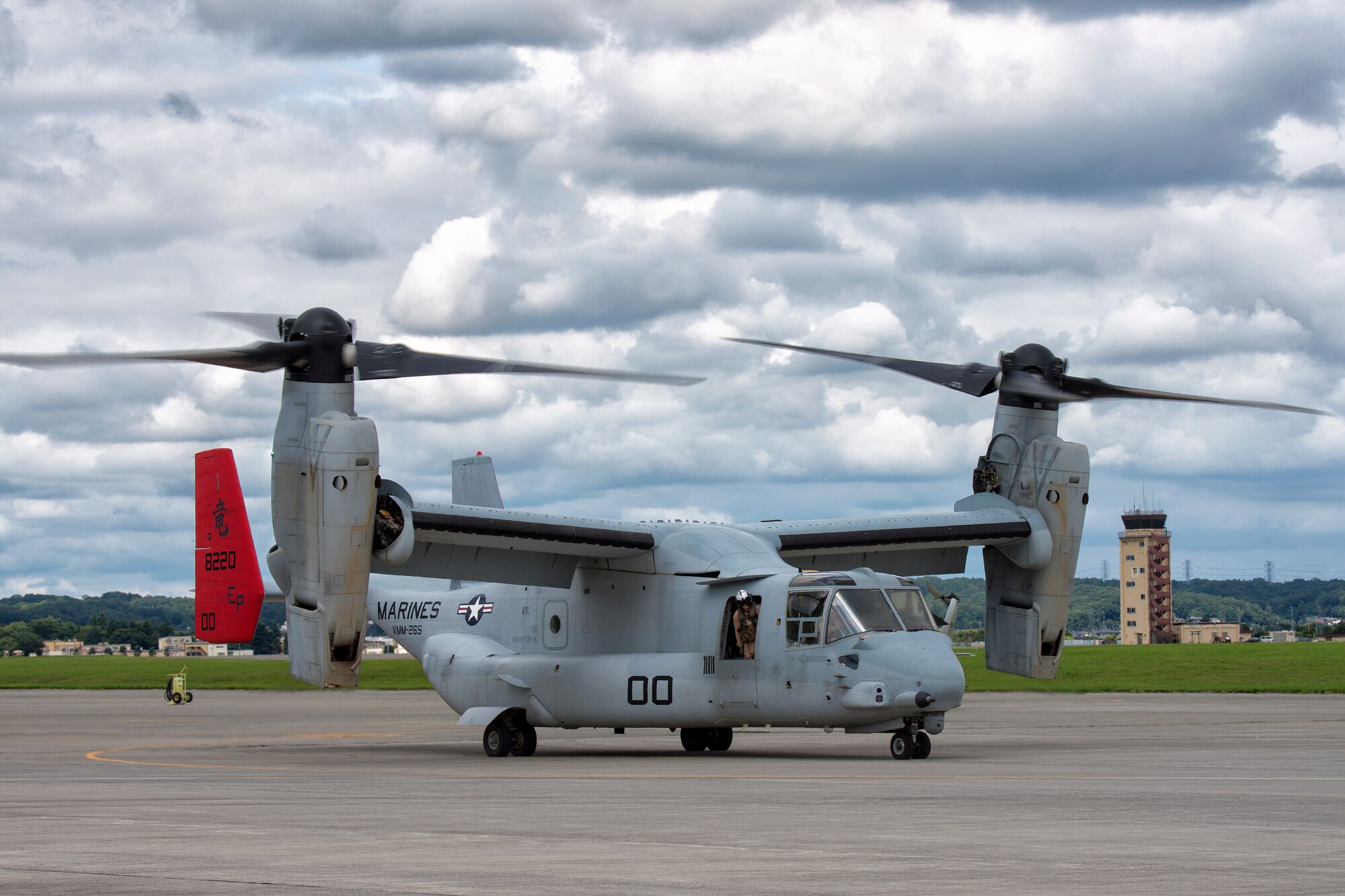 Two MV-22 Osprey assigned to VMM-265, 1st Marine Aircraft Wing, 3rd Marine Expeditionary Force, take off carrying relief supplies during a joint humanitarian aid and disaster relief exercise at Yokota Air Base, Japan, Aug. 31, 2014. The aircraft displayed its range and speed by traveling round trip from Yokota to Oshima Island in approximately one hour. Airmen and Marines conducted the exercise to increase joint interoperability and exercise crisis response capabilities. (U.S. Air Force photo by Osakabe Yasuo/Released)