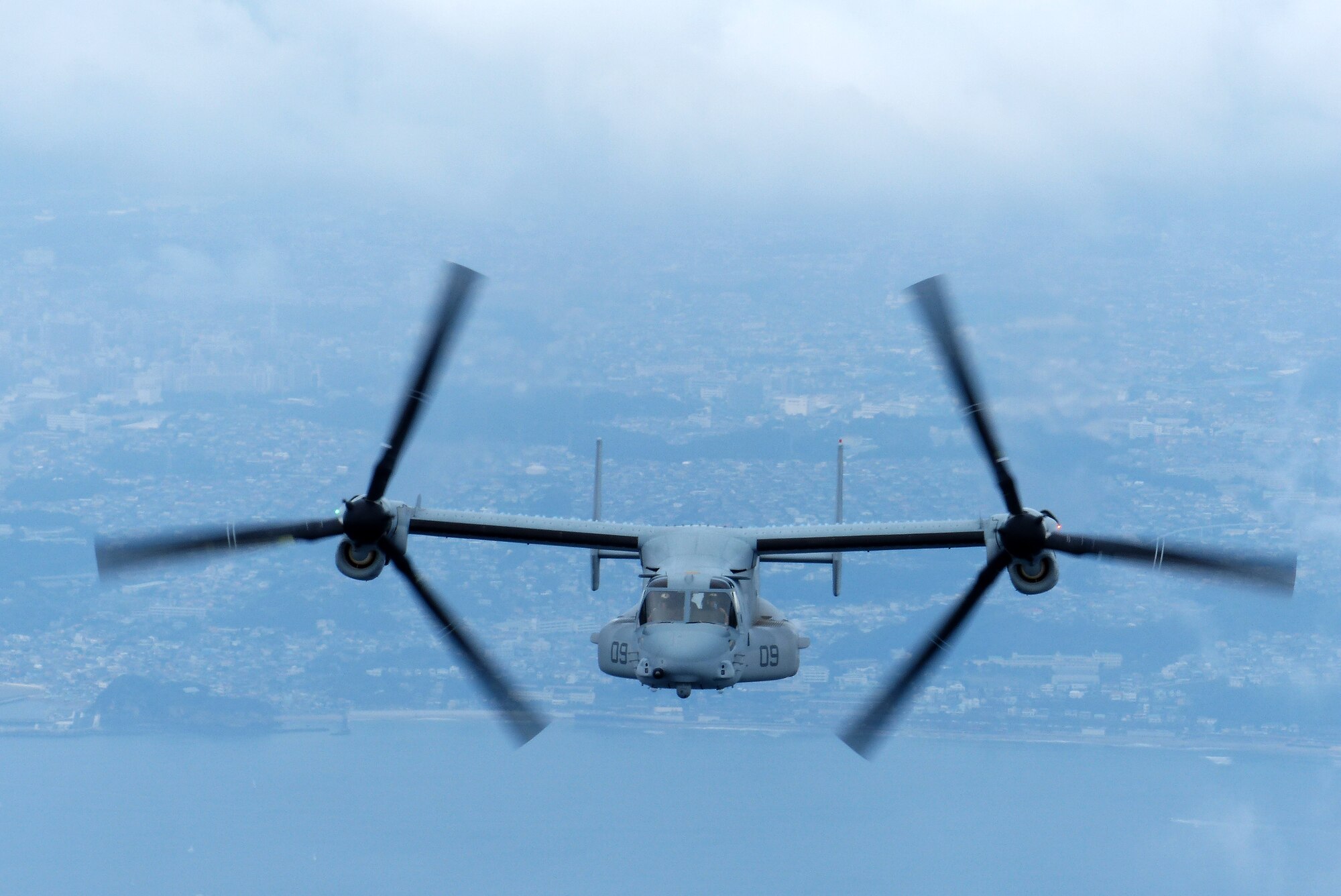 An MV-22 Osprey assigned to VMM-265, 1st Marine Aircraft Wing, 3rd Marine Expeditionary Force, carries relief supplies during a joint humanitarian aid/disaster relief exercise launched from Yokota Air Base, Japan, Aug. 31, 2014. The aircraft displayed its range and speed by traveling round trip from Yokota to Oshima Island in approximately one hour. Airmen and Marines conducted the exercise to increase joint interoperability and exercise crisis response capabilities in the event of a natural disaster. (U.S. Air Force photo by 1st Lt. Jake Bailey/Released)