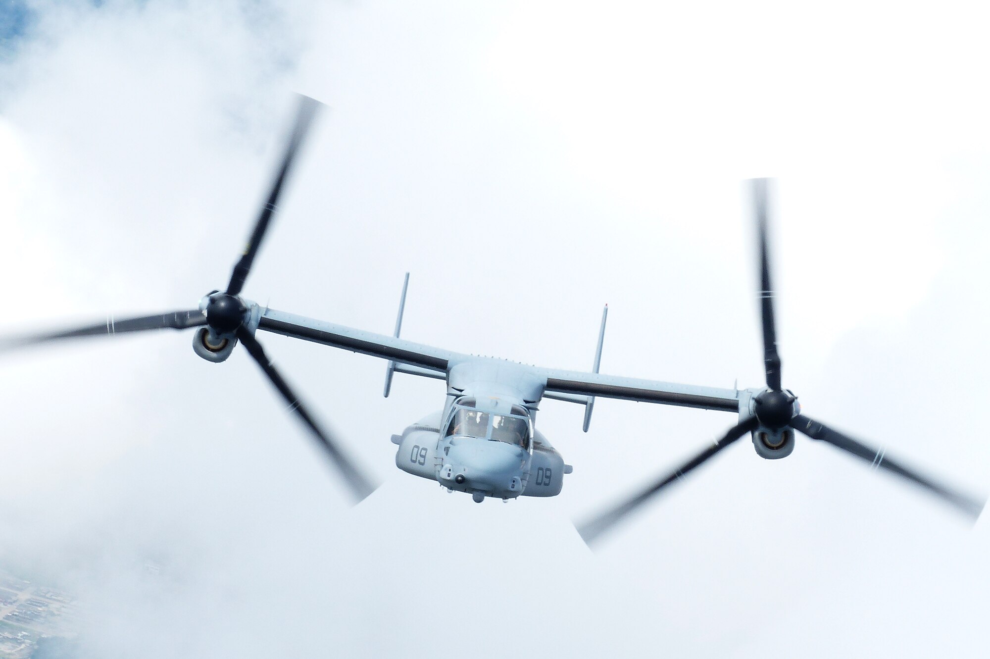 An MV-22 Osprey assigned to VMM-265, 1st Marine Aircraft Wing, 3rd Marine Expeditionary Force, carries relief supplies during a joint humanitarian aid/disaster relief exercise launched from Yokota Air Base, Japan, Aug. 31, 2014. The aircraft displayed its range and speed by traveling round trip from Yokota to Oshima Island in approximately one hour. Airmen and Marines conducted the exercise to increase joint interoperability and exercise crisis response capabilities in the event of a natural disaster. (U.S. Air Force photo by 1st Lt. Jake Bailey/Released)
