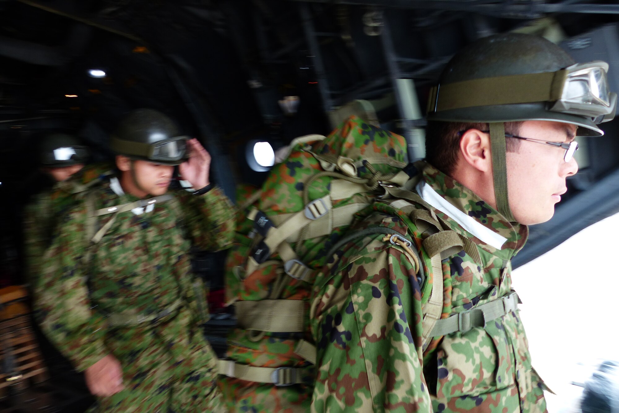 Japan Ground Self-Defense Force soldiers disembark a U.S. Air Force C-130H aircraft from the 374th Airlift Wing at Shizuoka Airport during a bilateral disaster relief exercise supporting Shizuoka Prefecture Government Aug. 31, 2014. Airmen from the 374th Airlift Wing supported three disaster management exercises with Japanese first responders and an additional joint exercise with Marine counterparts Aug. 30 and 31. (U.S. Air Force photo by 1st Lt. Jake Bailey/Released)