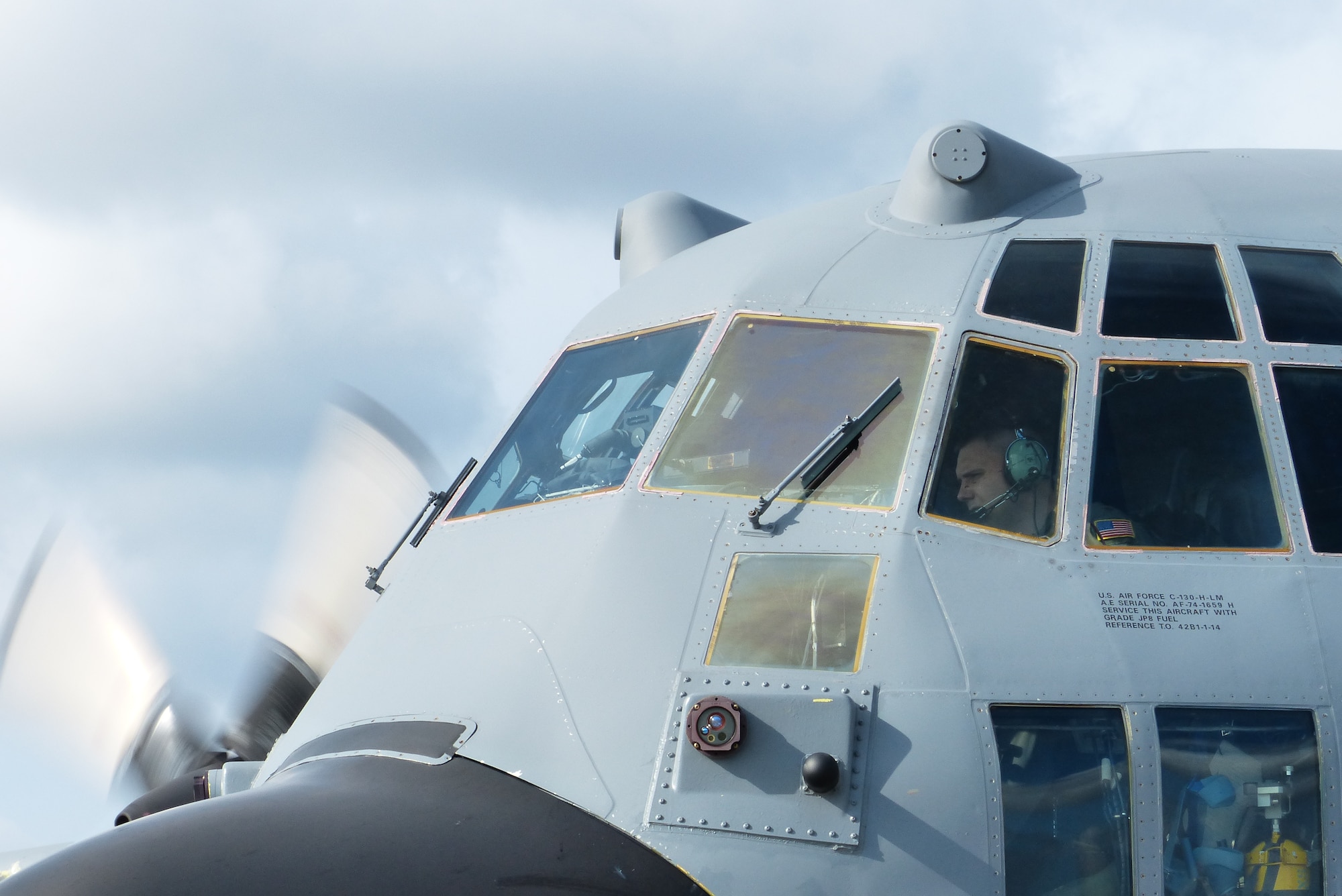 Maj. Adam Staubach, a pilot assigned to the 36th Airlift Squadron, Yokota Air Base, Japan, prepares a C-130H aircraft for flight during a bilateral disaster relief exercise supporting Shizuoka Prefecture Government Aug. 31, 2014. Airmen from the 374th Airlift Wing participated in three disaster management exercises with Japanese first responders and an additional joint exercise with Marine counterparts Aug. 30 and 31. (U.S. Air Force photo by 1st Lt. Jake Bailey/Released)