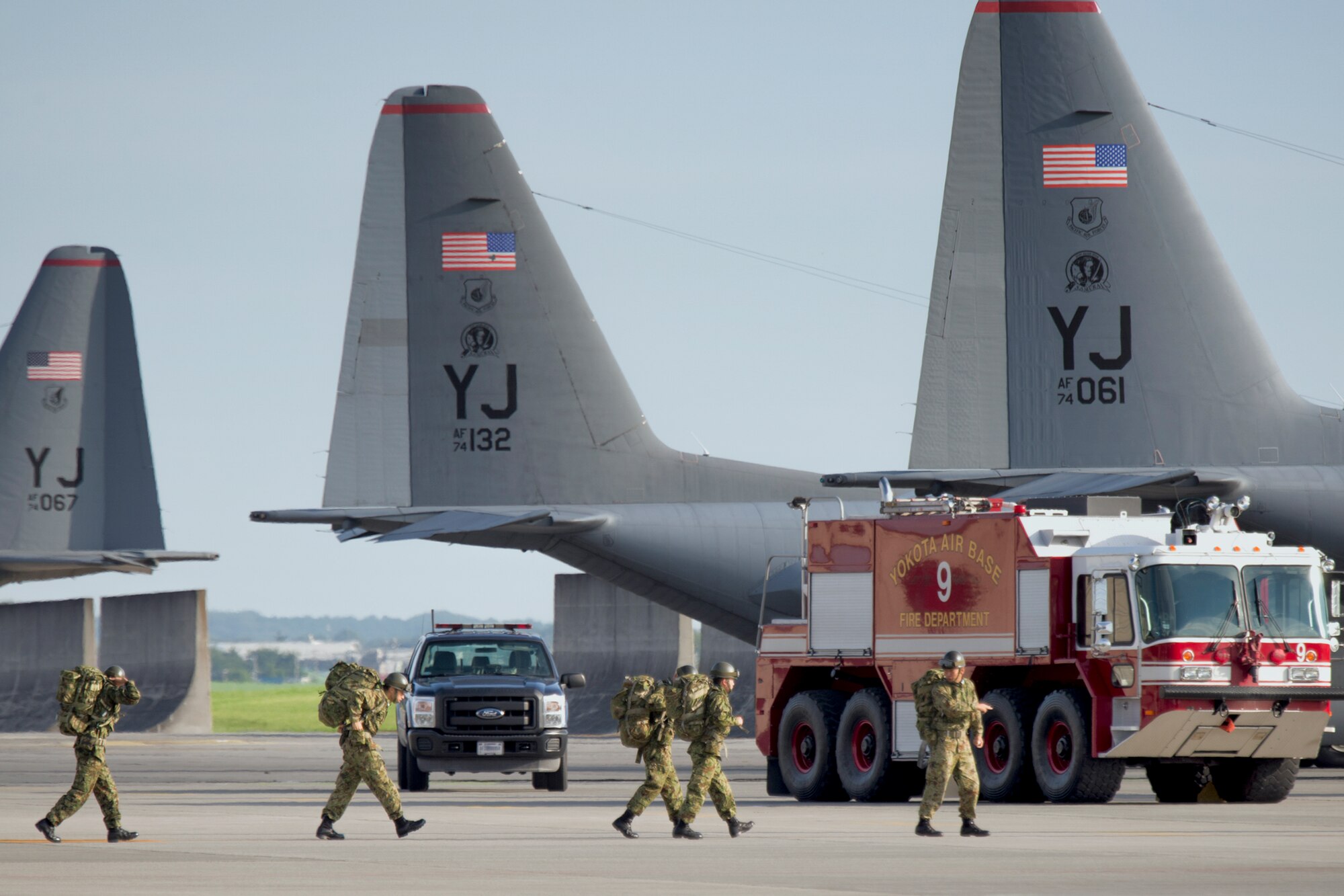Members from the Japan Ground Self-Defense Force board a C-130 Hercules at Yokota Air Base, Japan, Aug. 30, 2014, during the Shizuoka Comprehensive Disaster Drill.  The aircraft from the 36th Airlift Squadron airlifted JGSDF members to Shizuoka airport, where they boarded a JGSDF CH-47 Chinook helicopter for follow-on movement to a simulated disaster zone. (U.S. Air Force photo by Osakabe Yasuo/Released)
