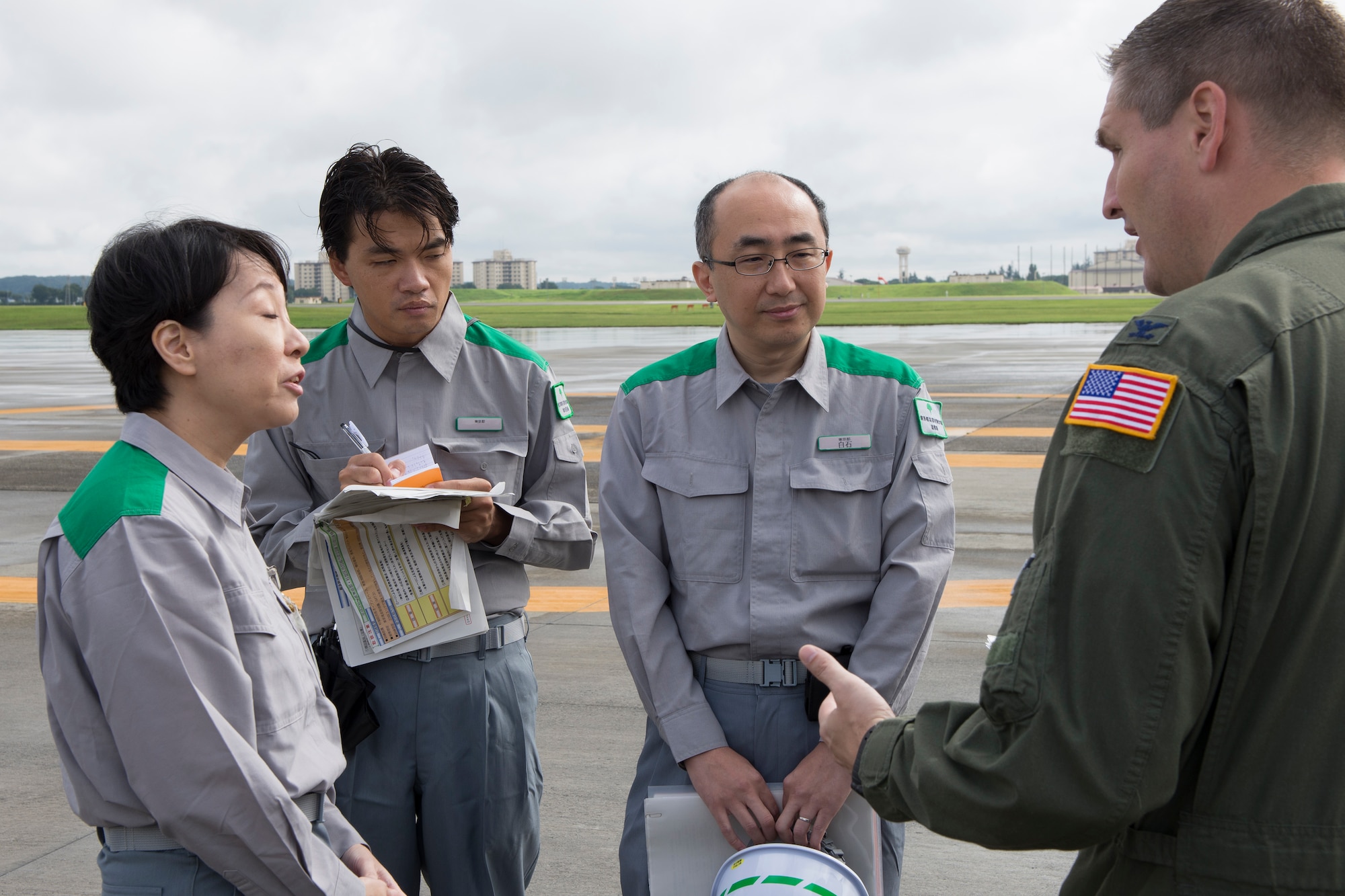 Col. Douglas DeLaMater, 374th Airlift Wing commander, talks with members of the Tokyo Metropolitan Government disaster prevention division at Yokota Air Base, Japan, Aug. 30, 2014. Yokota Airmen participated in the annual Tokyo Metropolitan Government Comprehensive Disaster Management Drill. (U.S. Air Force photo by Osakabe Yasuo/Released)