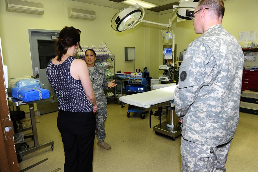 U.S. Army 1st Lt. Florlinda Gomez (left) and Col. David Wolken, both from the JTF-Bravo Medical Element, explain the on-base and expeditionary surgical capabilities of the Medical Element to Dr. Rebecca Chavez, the Deputy Assistant Secretary of Defense for Western Hemisphere Affairs, Aug. 28 during a command tour of Joint Task Force-Bravo at Soto Cano Air Base, Honduras.  (Photo by Martin Chahin)