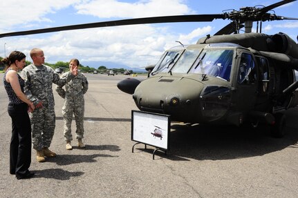 U.S. Army Staff Sgt. Kelly Steckler (left) and 1st Lt. Lauren Rattan, both from the 1-228th Aviation Regiment, explain the mission capabilities of the UH-60 Black Hawk Helicopter to Dr. Rebecca Chavez, the Deputy Assistant Secretary of Defense for Western Hemisphere Affairs, Aug. 28 during a command tour of Joint Task Force-Bravo at Soto Cano Air Base, Honduras.  (Photo by Martin Chahin)