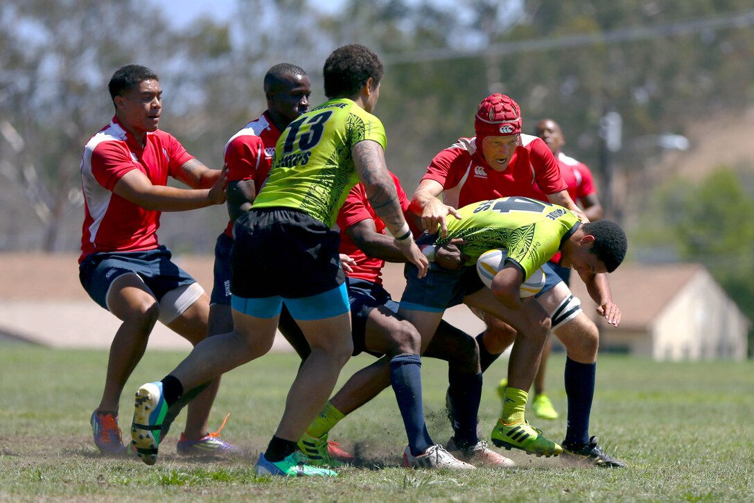 Marines and sailors are competing for a place on the All Navy and Marine Corps rugby team to represent our country in the Common Wealth Navies Rugby Cup located in New Zealand.There are currently 35 members of the All Navy and Marine Corps team, but only about 28 will be going to the rugby motherland. They claimed a 21-7 victory over the Oceanside Chiefs, a division two rugby team with three division titles and one national title, in their first local scrimmage at Paige Field House here, Aug. 30.(Photo by Cpl. Keenan Zelazoski)