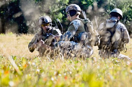 U.S. Air Force Master Sgt. John M. Oliver, left, a tactical air control party specialist with the Illinois Air National Guard’s 169th Air Support Operations Squadron, Latvian 1st Sgt. Modris Circenis and Latvian Cpl. Janis Gabranis, TACPs with the Latvian National Armed Forces, make a plan to advance on an enemy position during a reconnaissance mission as part of Operation Northern Strike, a training exercise at Camp Grayling Maneuver Training Center, Michigan. Northern Strike was a three week exercise led by the National Guard that demonstrated the combined power of joint and multi-national air and ground forces. TACPs with the 169th ASOS and more than 5,000 other Service members from 12 states and two coalition nations participated in the combat training. 