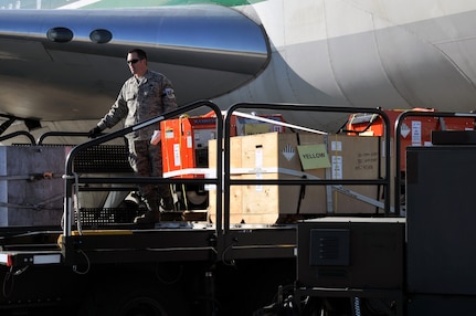 Master Sgt. Troy Brawner helps load cargo onto a 747 aircraft at the
167th Airlift Wing on Jan. 18, 2010. The air base in Martinsburg, W.Va., was transformed Jan. 14 into a staging area for more than 385,000 pounds of supplies bound for the airport at Port-au-Prince, Haiti.