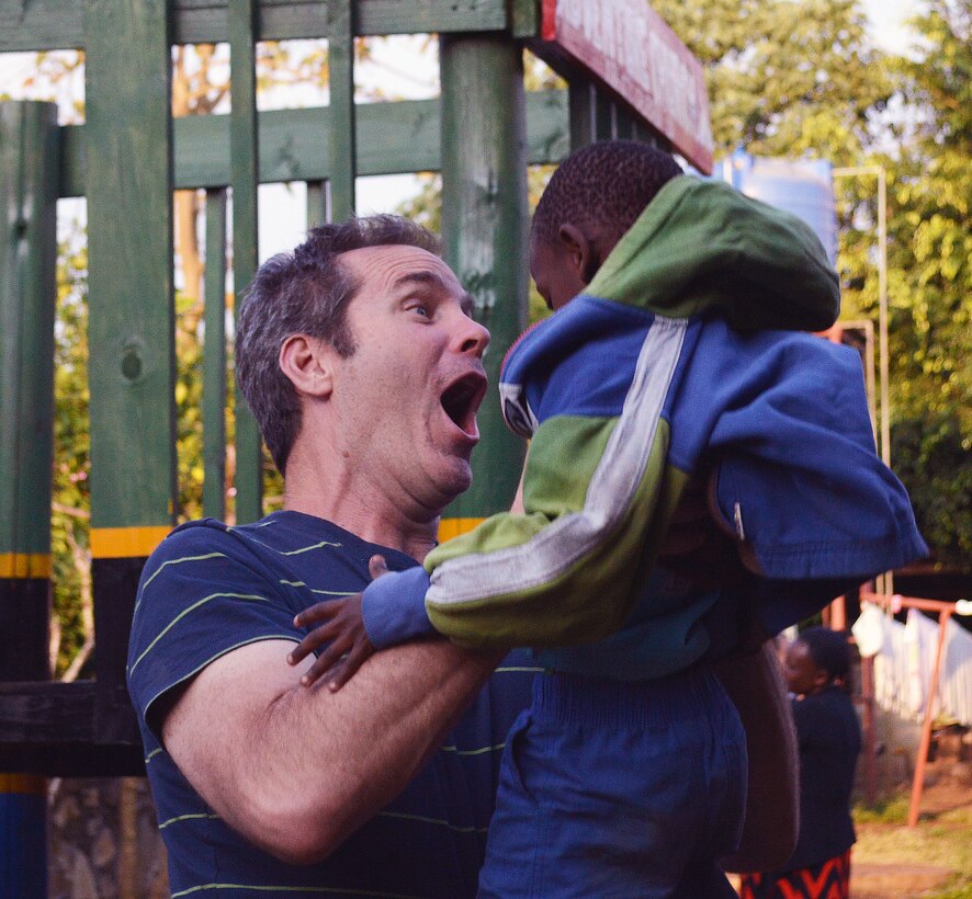 Getting to know the children in a Tanzanian orphanage was just as important as the construction work recently accomplished by a team of volunteers from Yuba City, California. Here, Brian Poole, a supervisory engineer in the U.S. Army Corps of Engineers Sacramento District engineering division, plays with a young friend at Samaritan Village just east of Arusha, Tanzania, in August 2014.