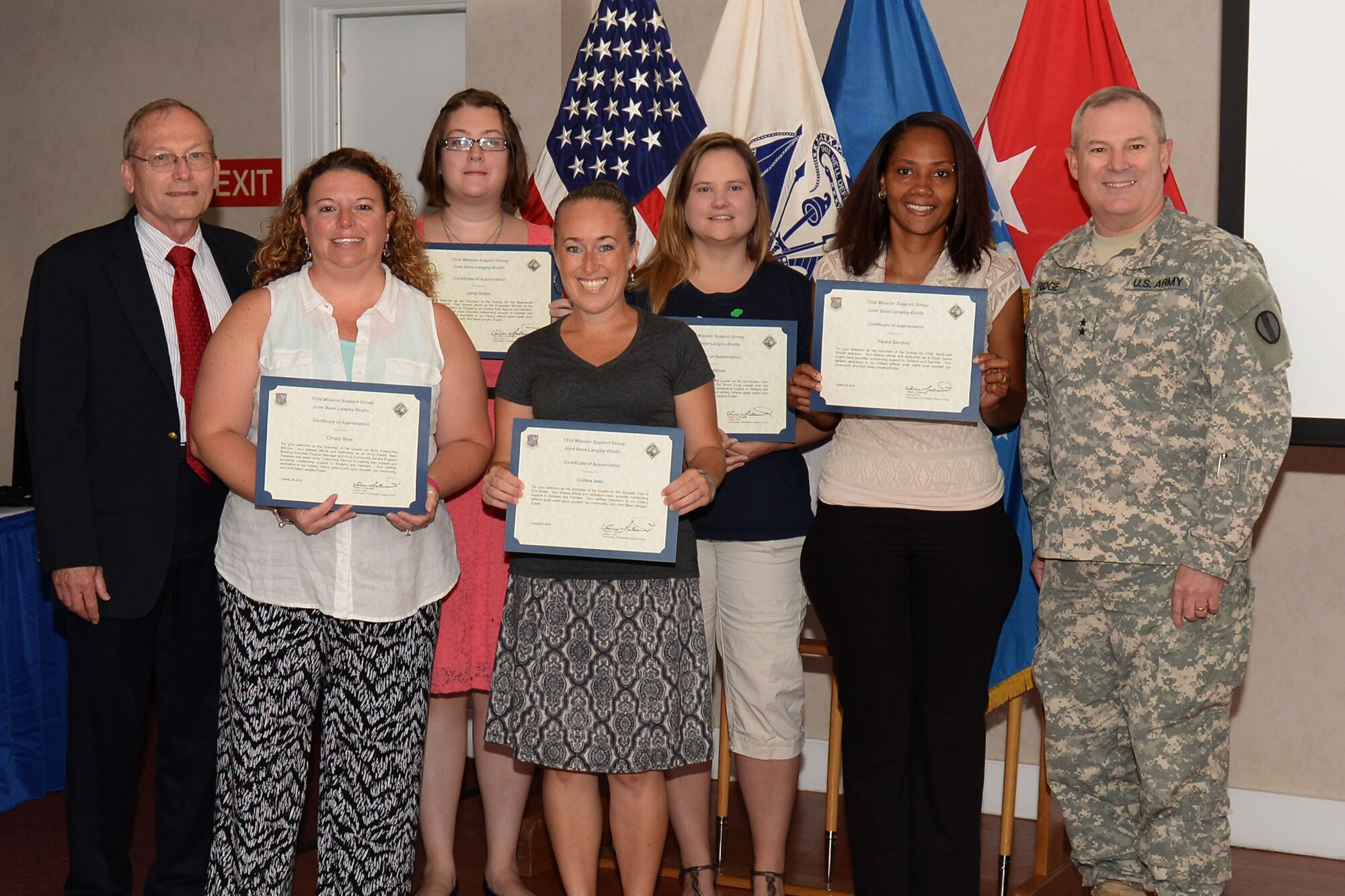 U.S. Army Maj. Gen. Ross Ridge, Initial Military Training Center of Excellence, U.S. Army Training and Doctrine Command deputy commanding general, and Joint Base Langley-Eustis Senior Army Element commander, presented certificates at a Volunteer of the Quarter ceremony at Fort Eustis, Va., Aug. 18, 2014. Six individuals from various units on the installation were recognized during the ceremony for their contributions to the JBLE community. (U.S. Air Force photo by Staff Sgt. Teresa J. Aber /Released)