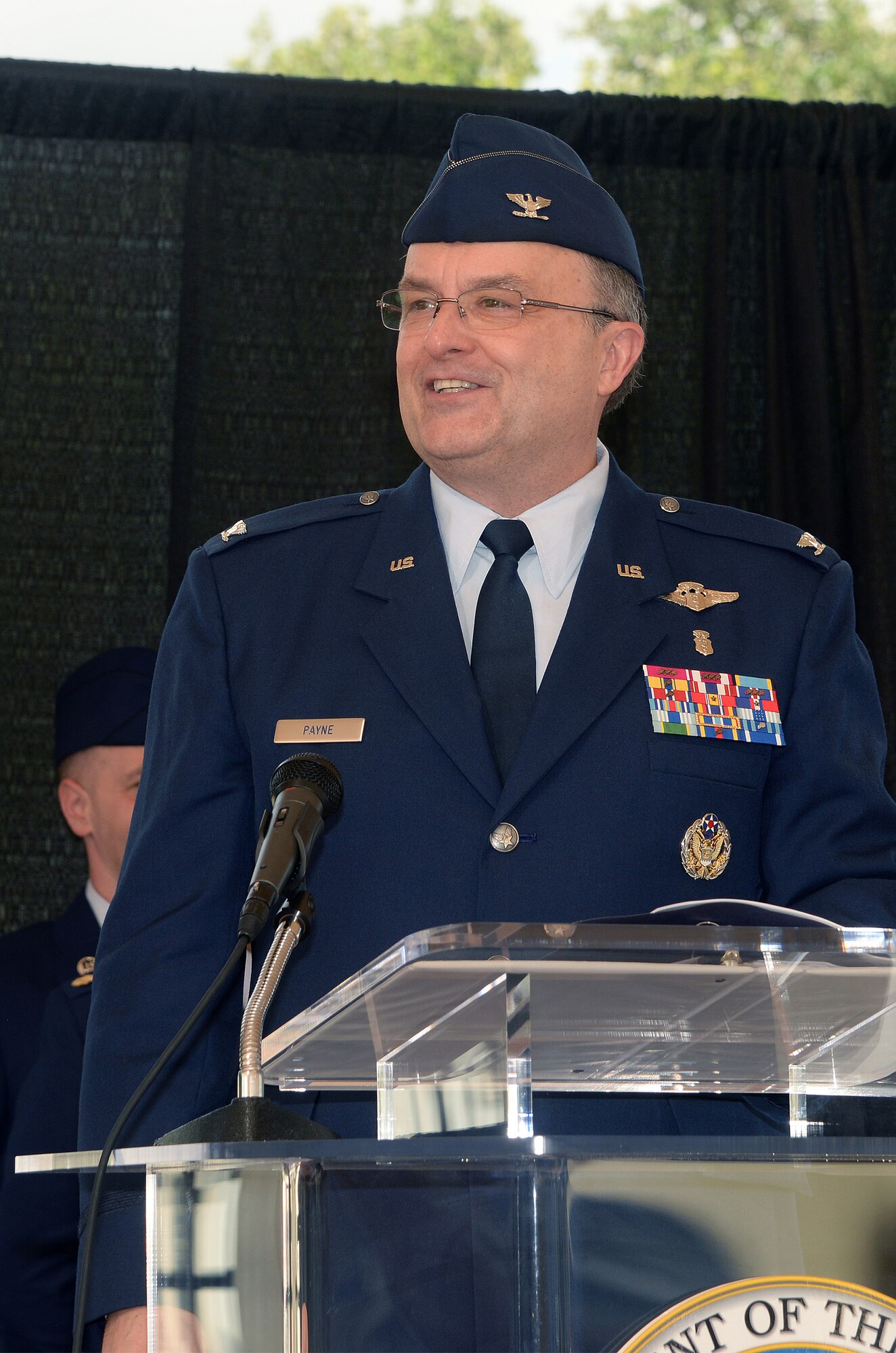 Col. Lee E. Payne accepts the guidon from Lt. Gen. Thomas W. Travis, Surgeon General of the Air Force, and assumes command of the Air Force Medical Operations Agency during a change of command ceremony at Joint Base San Antonio-Lackland Kelly Field Annex Aug. 29, 2014.  AFMOA oversees the execution of the Air Force Surgeon General policies supporting Air Force expeditionary capabilities, healthcare operations and national security strategy. Col. Payne will be responsible for leading consultative support of over 43,000 personnel, 75 Medical Treatment Facilities with a $6.1 billion budget. (U.S. Air Force Photo by Johnny Saldivar)