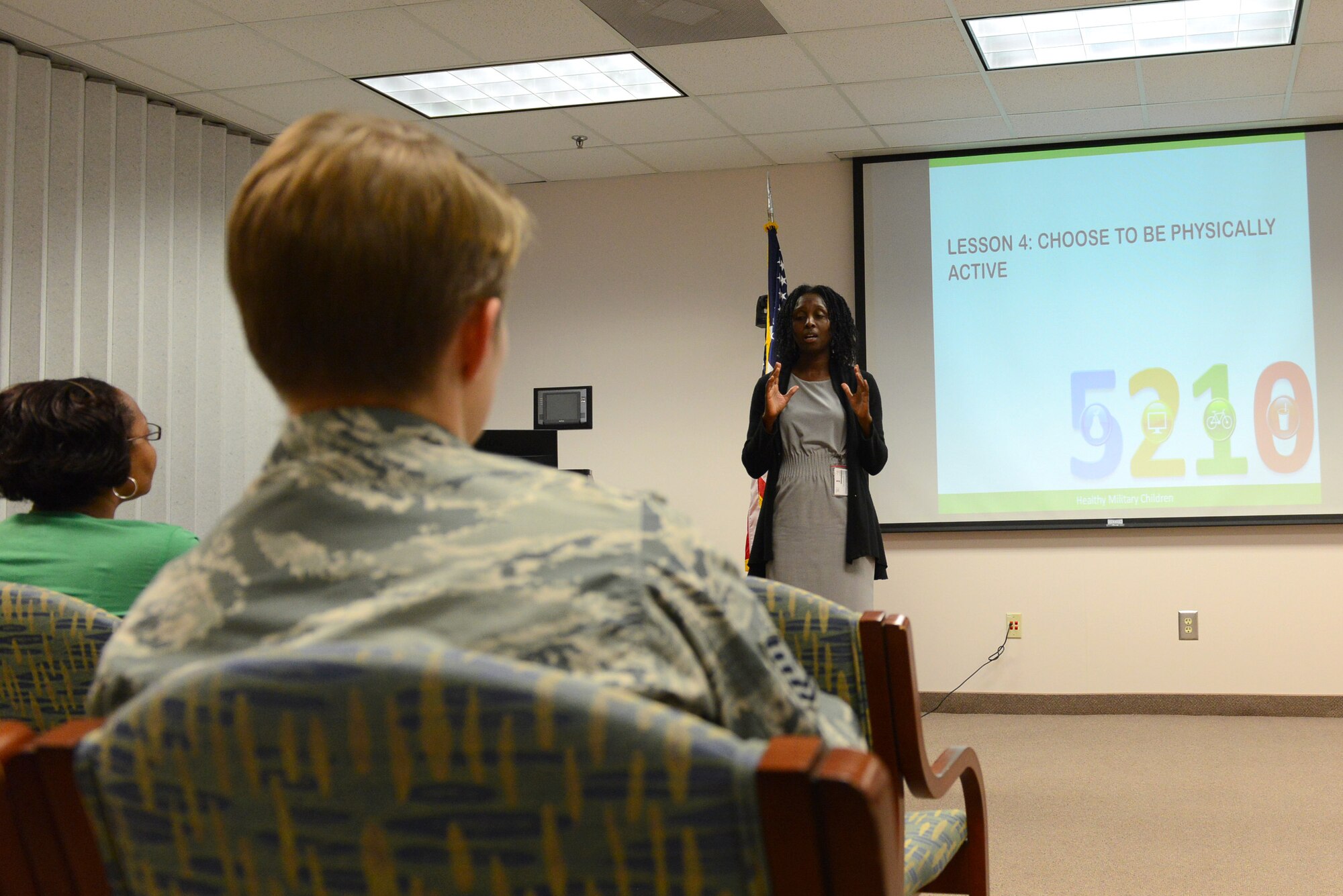 Bonita Clemons, 20th Medical Operations Squadron health promotion registered dietitian, lectures about implementing healthy habits during a 5210 Healthy Military Children class, Shaw Air Force Base, S.C., Sept. 2, 2014. 5210 stands for five or more fruits and vegetables, two hours or less of being engaged in television or video games, one hour or more of physical activity, and zero sugary drinks a day. (U.S. Air Force photo by Airman 1st Class Diana M. Cossaboom/Released)