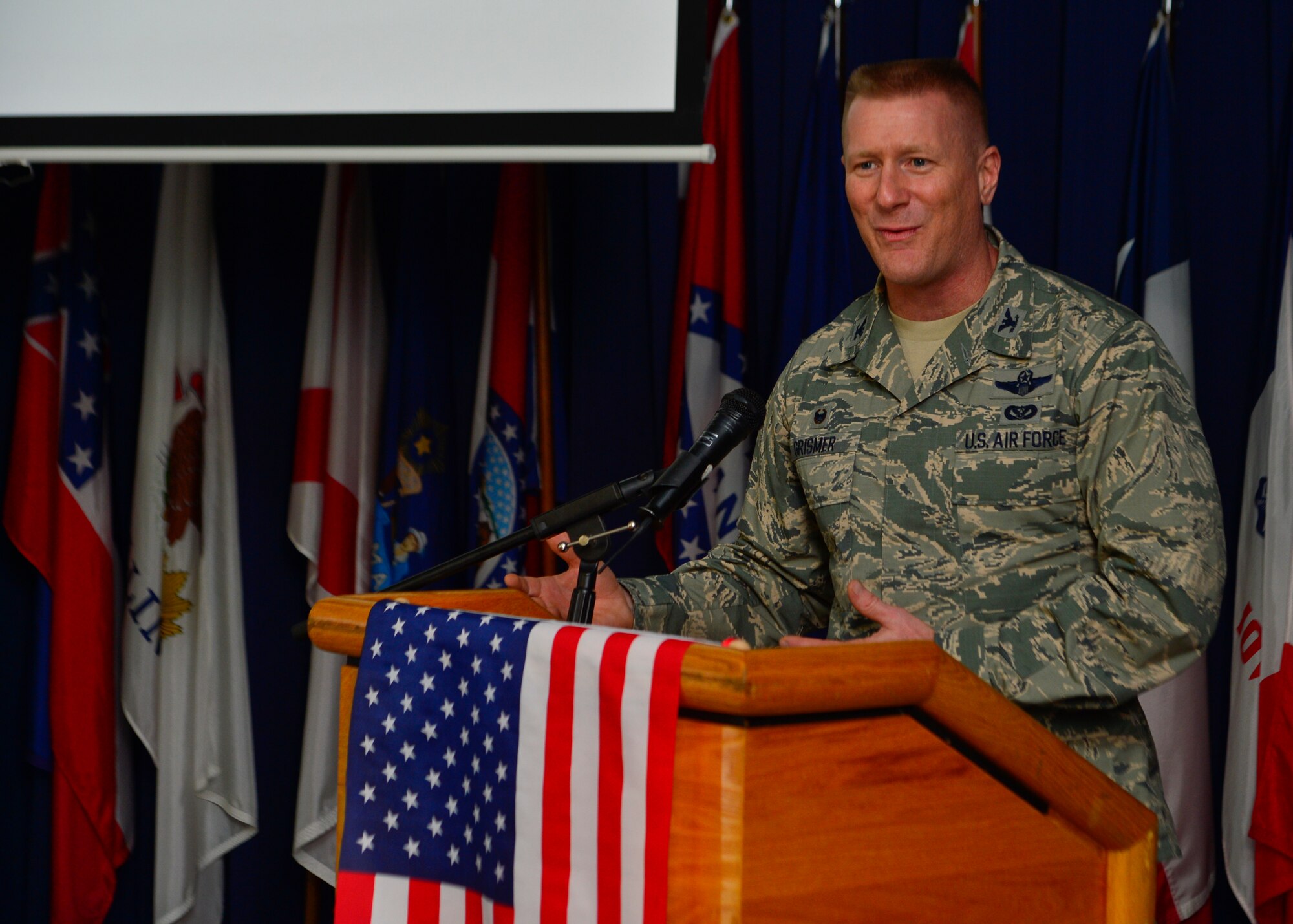 Col. Michael Grismer, 436th Airlift Wing commander, gives closing remarks at the Women’s Equality Day luncheon Aug. 26, 2014, at the Landings on Dover Air Force Base, Del. Grismer spoke about the many contributions that women have made throughout American history including in the military. (U.S. Air Force photo/Airman 1st Class William Johnson)
