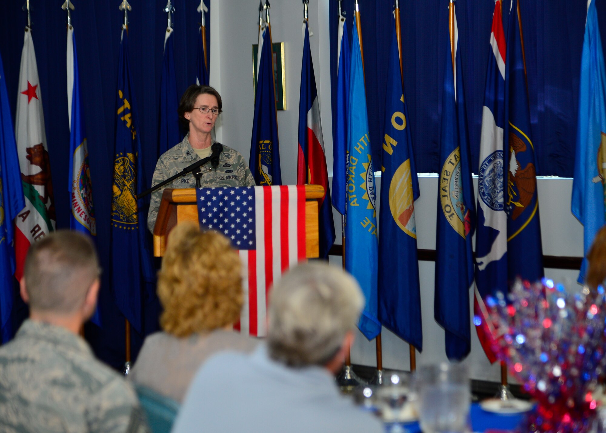 Col. Lisa Pike, 436th Mission Support Group commander, gives a speech during the Women’s Equality Day luncheon Aug. 26, 2014, at the Landings on Dover Air Force Base, Del. Pike was invited to be the guest speaker at the event and spoke about the history of women’s suffrage. (U.S. Air Force photo/Airman 1st Class William Johnson)