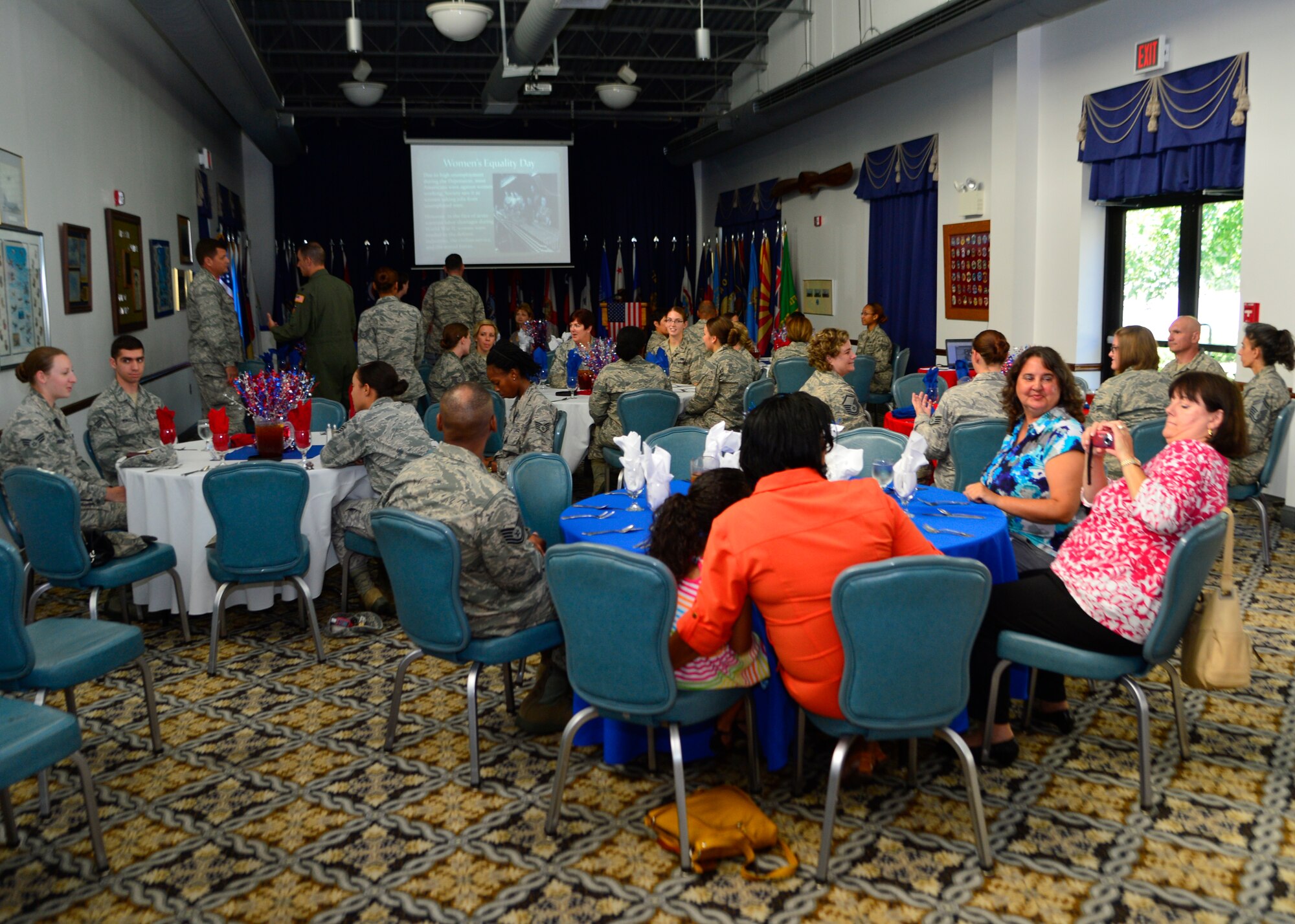 Members of Team Dover attend the Women’s Equality Day luncheon Aug. 26, 2014, at the Landings on Dover Air Force Base, Del. More than 55 guests attended to luncheon to learn about how women gained the right to vote and how their contributions to the military changed America. (U.S. Air Force photo/Airman 1st Class William Johnson)