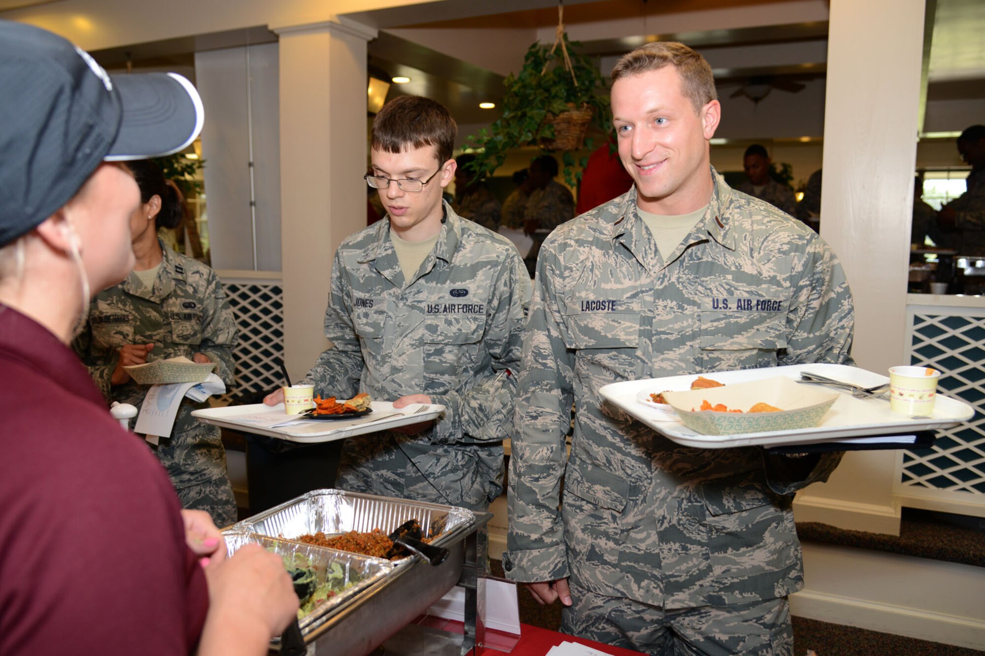 U.S. Air Force 2nd Lt. James LaCoste listens to a food vendor representative talk about their food's nutritional value at the Inaugural Langley Air Force Base Food Show at Langley Air Force Base, Va., Aug. 27, 2014. The food vendors presented mostly "green label" foods, which are considered healthier options. (U.S. Air Force photo by Airman 1st Class Devin Scott Michaels)(This photo was cropped to emphasize the subject and the levels were adjusted for aesthetic purposes)