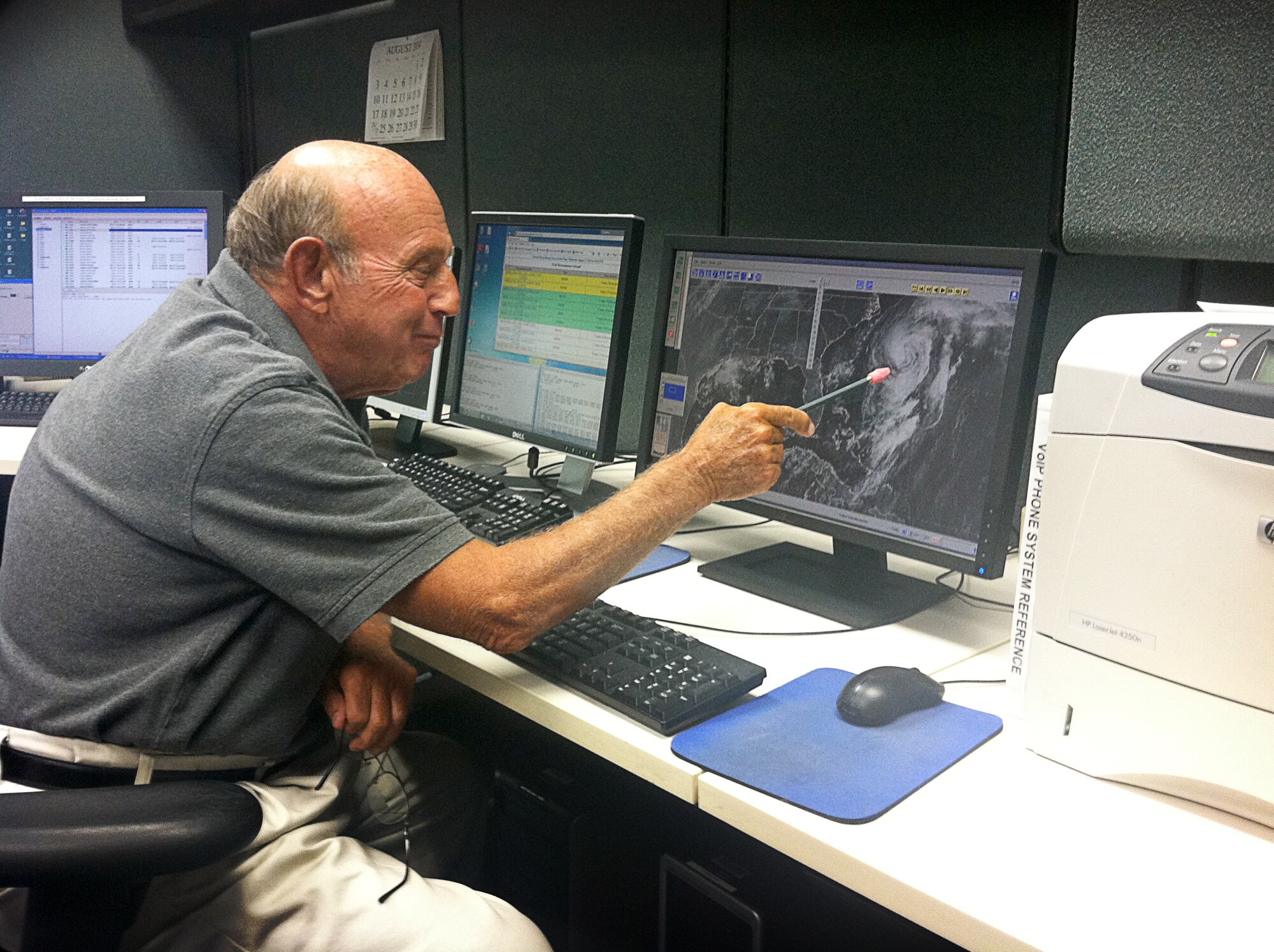 John Pavone, a supervisory meteorologist and aircraft coordinator with the Chief, Aerial Reconnaissance Coordination All Hurricanes (CARCAH) cell in the National Hurricane Center, checks on Hurricane Cristobal Aug 27. (U.S. Air Force Photo/Master Sgt. Brian Lamar)