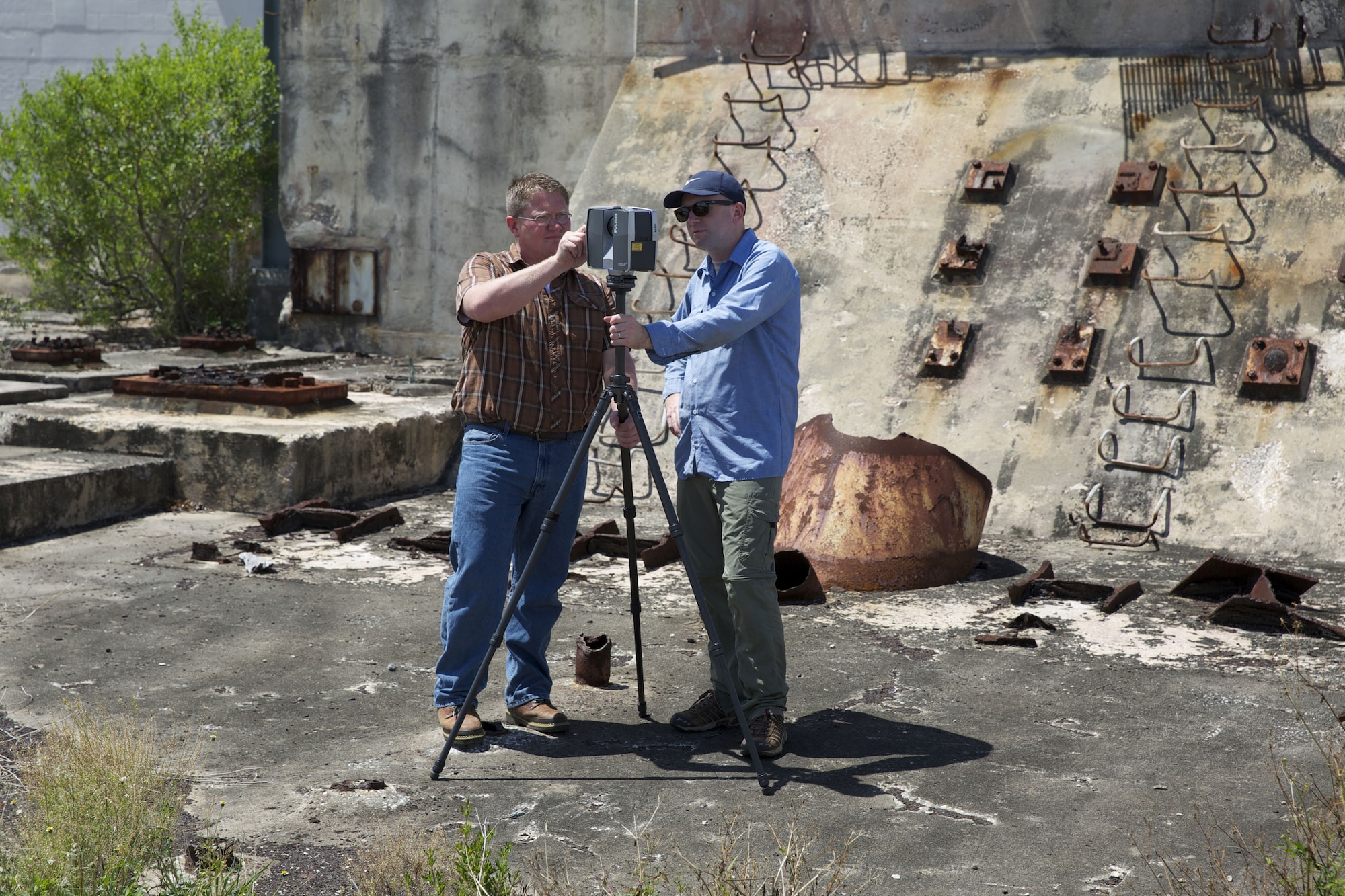 From left, James McLeod and Jeffrey Du Vernay, research associates with the Alliance for Integrated Spatial Technologies at the University of South Florida, set up a tripod-based laser scanner at Launch Complex 14 at Cape Canaveral Air Force Station, Fla. The AIST team is partnering with the Air Force to capture three-dimensional laser scans of National Historic Landmarks like this to document the condition of these deteriorating complexes. Launch Complex 14 was the site of several manned Mercury launches in the ‘60s including the Friendship 7 flight on Feb. 20, 1967, aboard which John H. Glenn, Jr. became the first American to orbit the Earth. (U.S. Air Force photo/Eddie Green/Released)