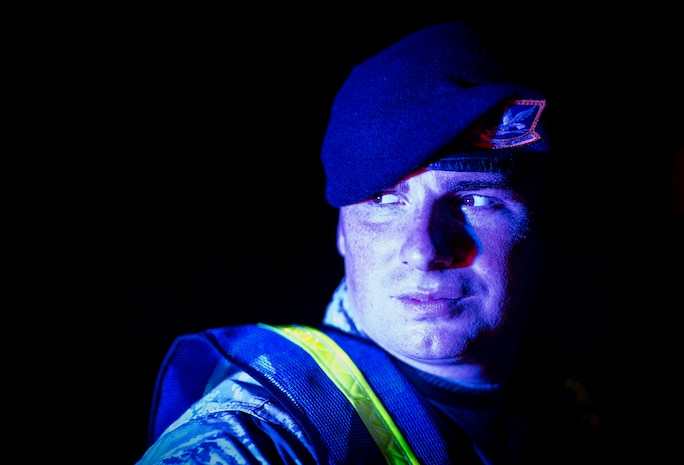 Staff Sgt. Patrick Poss, 628th Security Forces Squadron patrolman, participates alongside local sheriffs and police officers during a DUI checkpoint, Aug. 29, 2014 in North Charleston. The joint checkpoint allowed for officers from different agencies to gain a better understanding of how each department works. Holding DUI checkpoints help deter drivers from drinking and driving. (U.S. Air Force photo/Staff Sgt. William O'Brien)