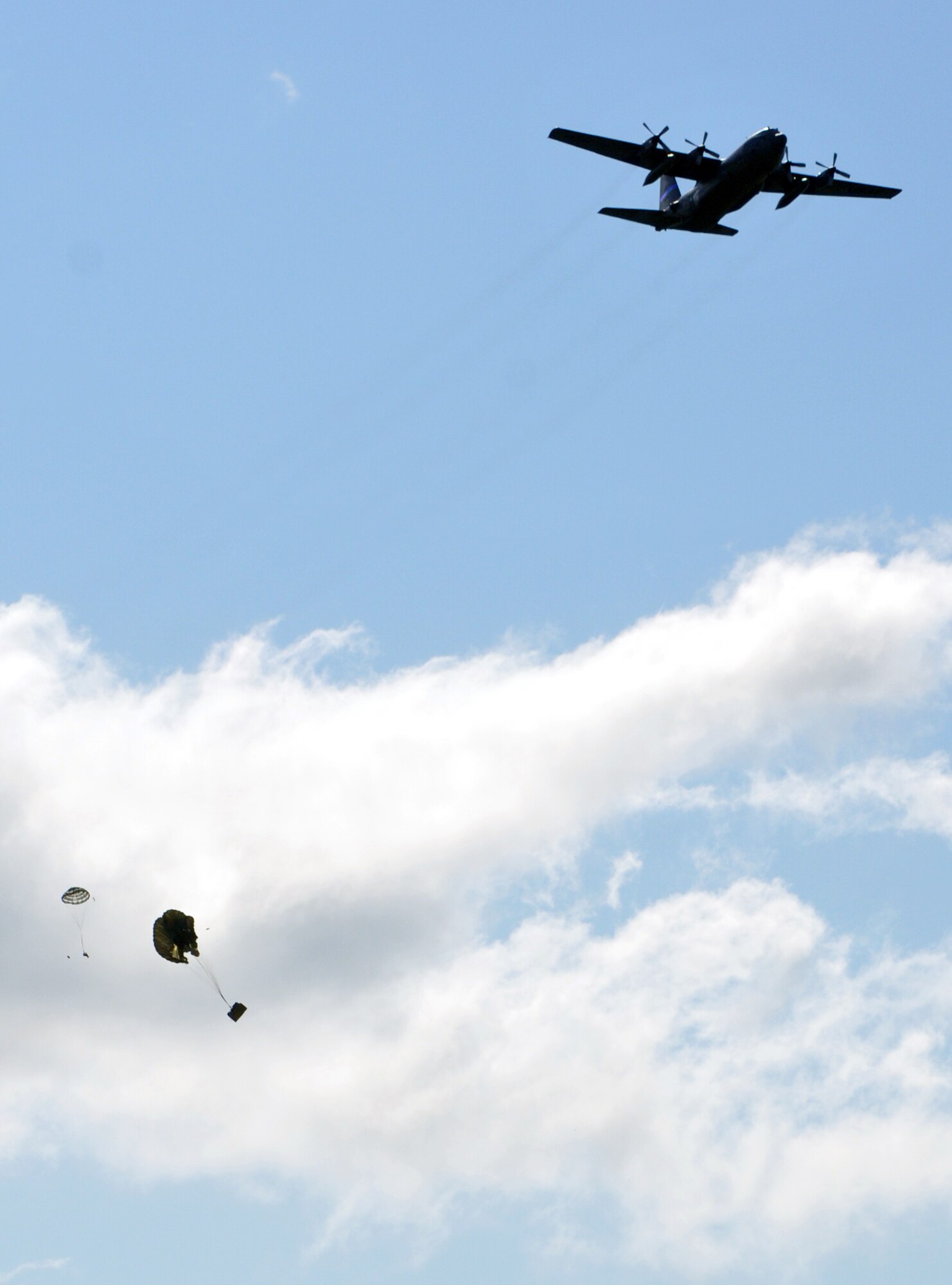 A C-130 from the 192nd Airlift Squadron, 152nd Airlift Wing, Nevada Air National Guard, drops cargo during the National Guard PATRIOT Exercise at Volk. Field, Wis., July 23, 2014. Units from the Air National Guard, Army National Guard and the Reserves throughout the United States are working with local, state and national organizations to train on and assess their ability to respond to multiple emergencies. (U.S Air Force photo/Tech. Sgt. Eric Ritter)