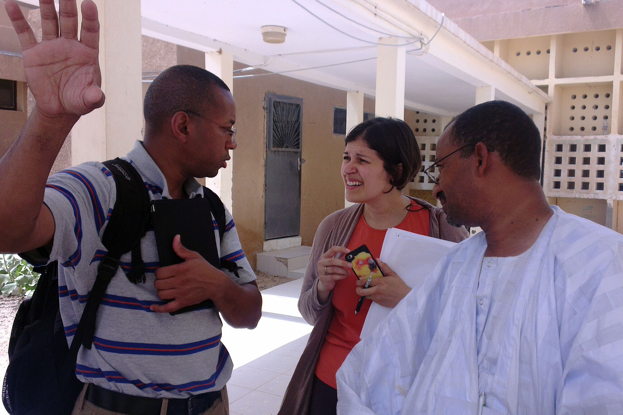 Capt. Mohammed Diallo, critical care nurse and interpreter from Walter Reed Hospital, left, translates for Dr. Abdoullah Ould Hmeyade, Centre Hospitalier D’Atar director and U.S. Air Force Capt. Brandy Sande, physician assistant from U.S. Air Forces Africa, center, following a hospital visit during African Partnership Flight Mauritania, in Atar, Mauritania, Sept. 2, 2014.  The team is assigned to the APF as the medical support team but took an opportunity to inspect the hospital and meet with the staff. (U.S. Air Force photo/Master Sgt. Brian Boisvert/Released)