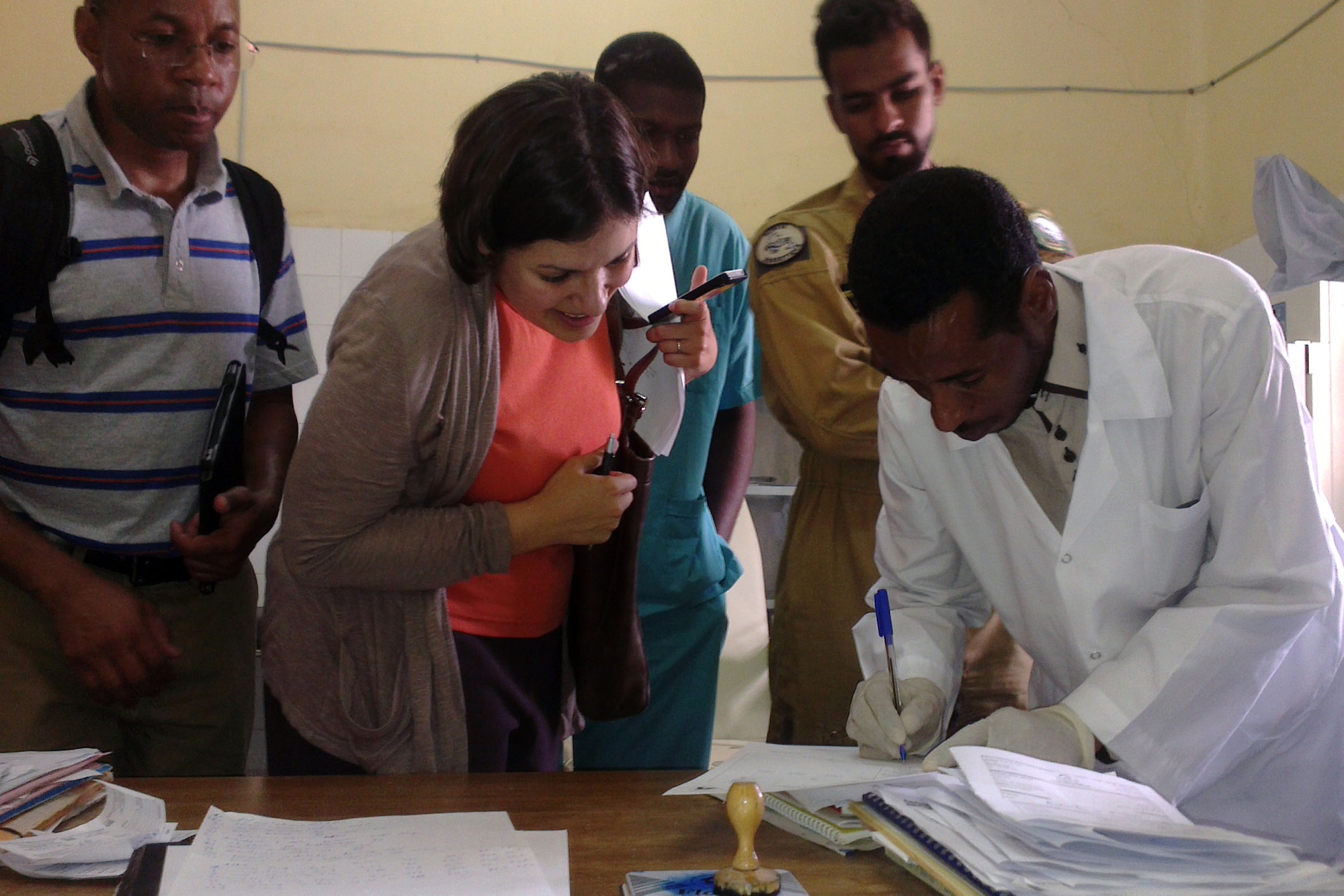 Capt. Brandy Sande, physician assistant from U.S. Air Forces Africa, center, Asdel Kader, senior lab technician, right, with Capt. Mohammed Diallo, critical care nurse and interpreter, left, at the Centre Hospitalier D’Atar in Atar, Mauritania, Sept. 2, 2014.  The medical team is assigned to the African Partnership Flight Mauritania and took an opportunity to check on the local hospital conditions and meet with the staff to understand how the hospital is organized and what services are offered. (U.S. Air Force photo/Master Sgt. Brian Boisvert/Released)