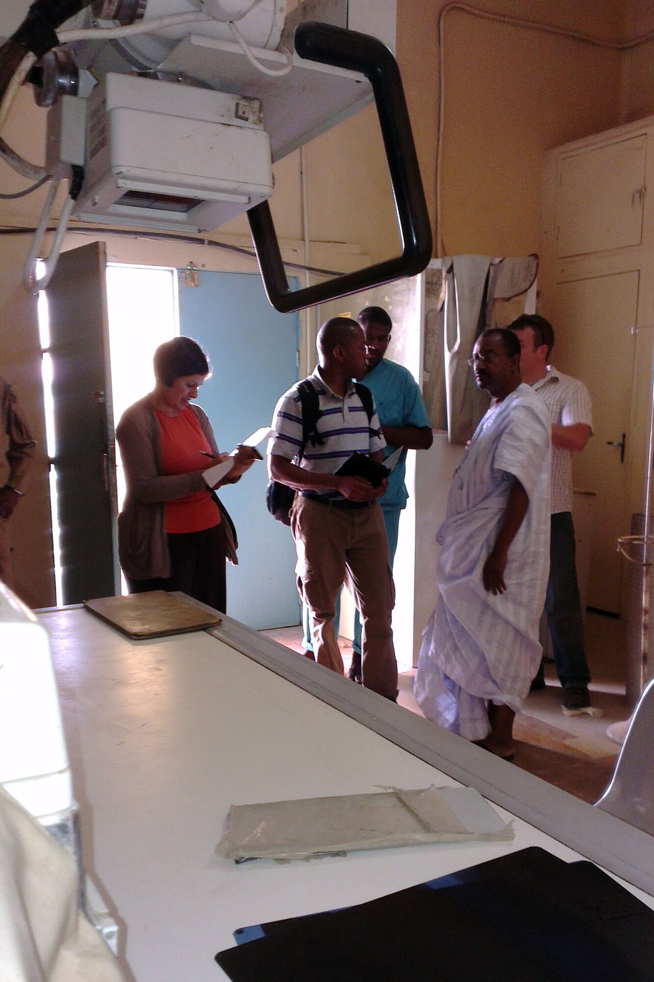 Capt. Brandy Sande, physician assistant from U.S. Air Forces Africa, left, and Maj. Michael Morrow, flight nurse from the 818th Mobility Support Advisory Squadron, Joint Base McGuire-Dix-Lakehurst, N.J., right, lead a hospital check with Capt. Mohammed Diallo, critical care nurse and interpreter, center, and Dr. Abdoullah Ould Hmeyade, Centre Hospitalier D’Atar director as part of the African Partnership Flight Mauritania, in Atar, Mauritania, Sept. 2, 2014.  The team is assigned to the APF as the medical support team but took an opportunity to visit the local hospital status and to meet with the staff. (U.S. Air Force photo/Master Sgt. Brian Boisvert/Released)
